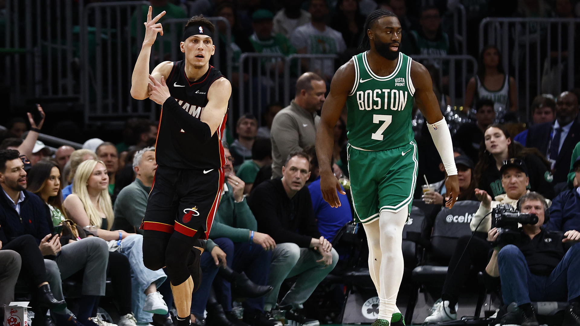Tyler Herro #14 of the Miami Heat celebrates a three-point basket as he runs past Jaylen Brown #7 of the Boston Celtics during the third quarter of game two of the Eastern Conference First Round Playoffs at TD Garden on April 24, 2024 in Boston, Massachusetts.
