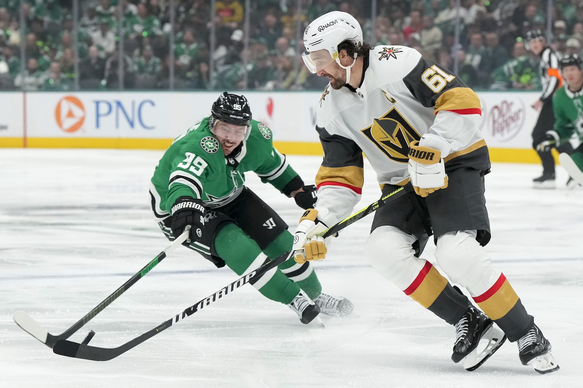 DALLAS, TEXAS - APRIL 22: Mark Stone #61 of the Vegas Golden Knights is defended by Matt Duchene #95 of the Dallas Stars during the third period in Game One of the First Round of the 2024 Stanley Cup Playoffs at the American Airlines Center on April 22, 2024 in Dallas, Texas. (Photo by Sam Hodde/Getty Images)