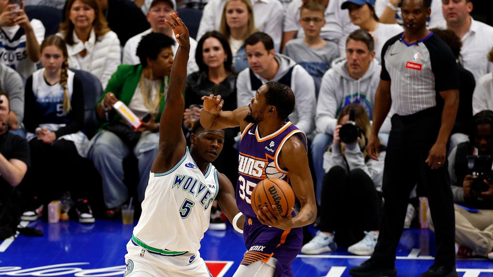 Anthony Edwards #5 of the Minnesota Timberwolves fouls Kevin Durant #35 of the Phoenix Suns in the first quarter of game two of the Western Conference First Round Playoffs at Target Center on April 23, 2024 in Minneapolis, Minnesota.