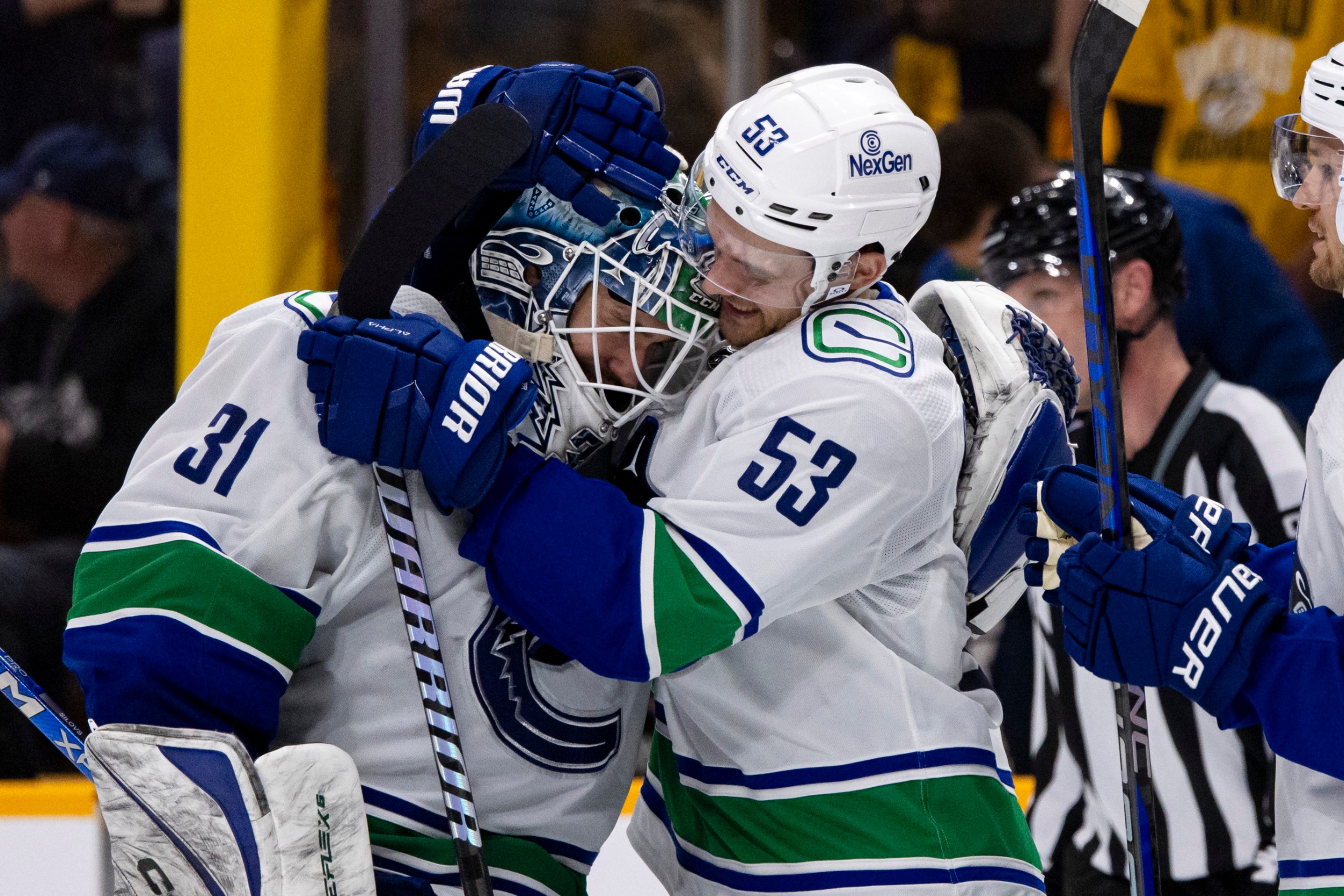 NASHVILLE, TENNESSEE - APRIL 28: Arturs Silovs #31 and Teddy Blueger #53 of the Vancouver Canucks celebrate after defeating the Nashville Predators during overtime of Game Four of the First Round of the 2024 Stanley Cup Playoffs at Bridgestone Arena on April 28, 2024 in Nashville, Tennessee. (Photo by Brett Carlsen/Getty Images) *** Local Caption *** Arturs Silovs; Teddy Blueger