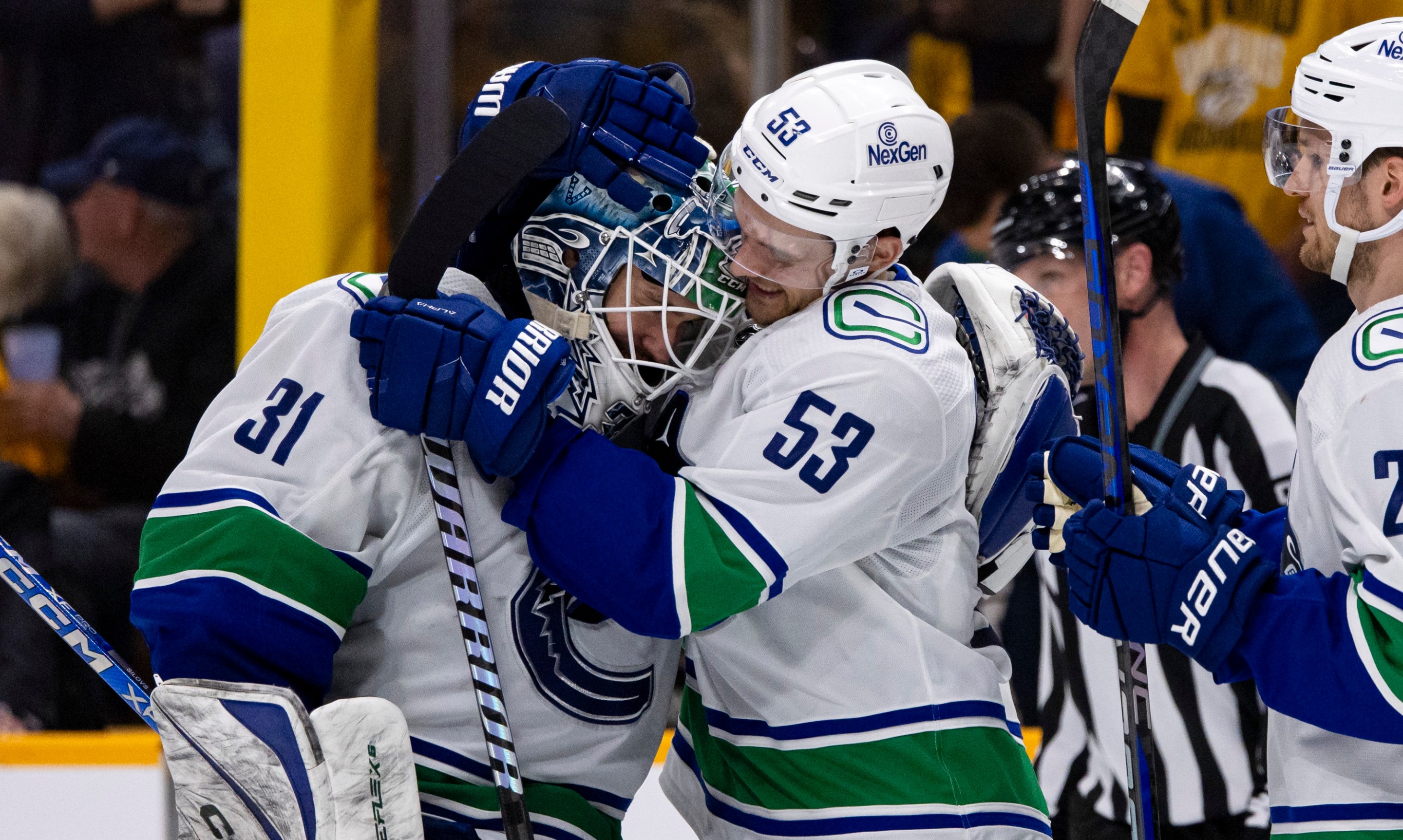 NASHVILLE, TENNESSEE - APRIL 28: Arturs Silovs #31 and Teddy Blueger #53 of the Vancouver Canucks celebrate after defeating the Nashville Predators during overtime of Game Four of the First Round of the 2024 Stanley Cup Playoffs at Bridgestone Arena on April 28, 2024 in Nashville, Tennessee. (Photo by Brett Carlsen/Getty Images) *** Local Caption *** Arturs Silovs; Teddy Blueger
