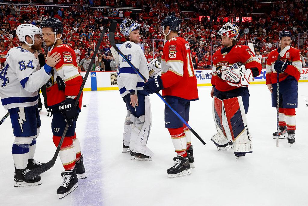 Andrei Vasilevskiy and Aleksander Barkov shake hands after the Panthers win