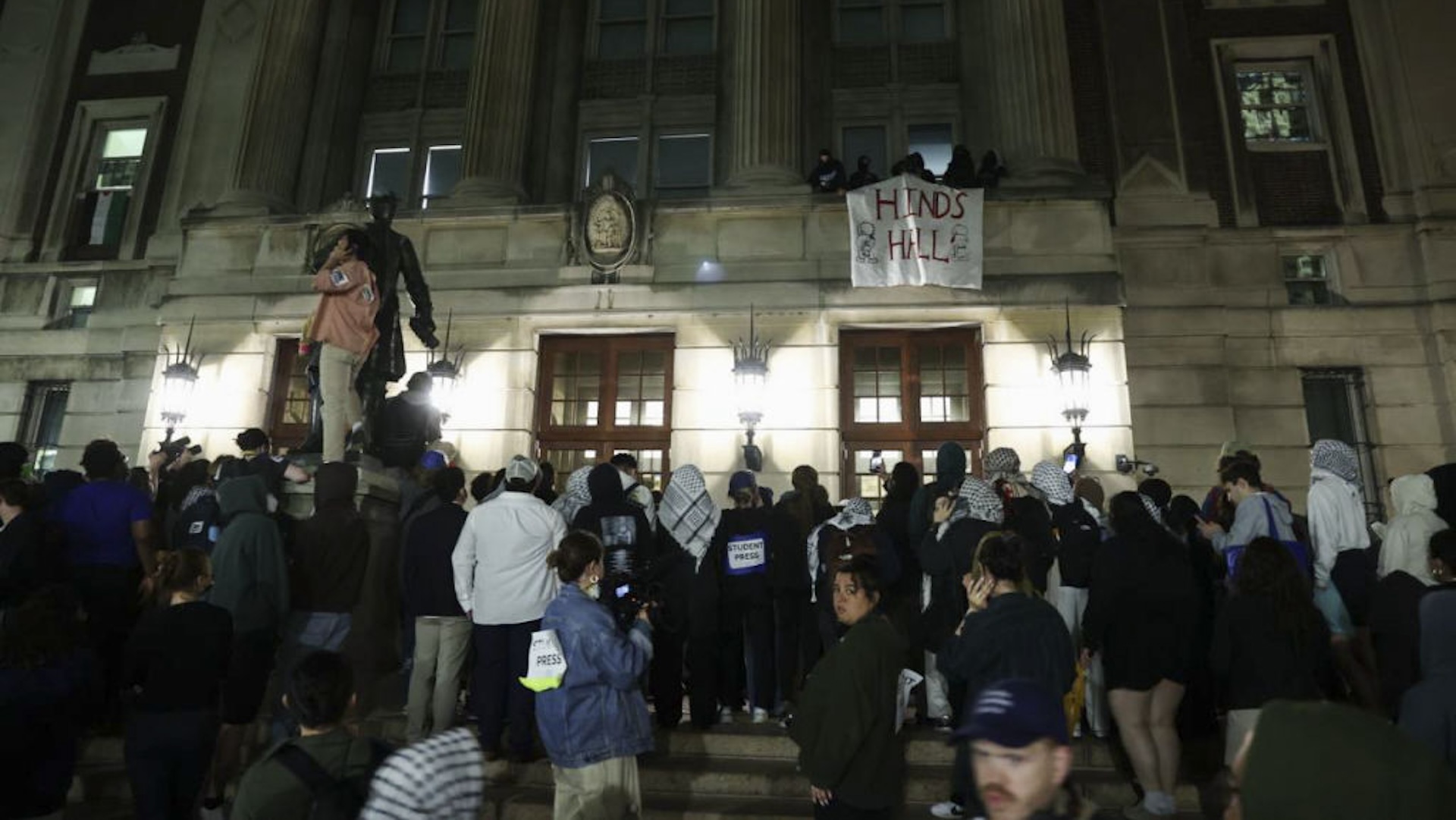 A group of Columbia University students, advocating for Palestinians, access the iconic Hamilton Hall building as they gather to stage a demonstration at the campus in New York, United States on April 30, 2024. Protests are sweeping college campuses across the US following a police attempt to clear a pro-Palestinian encampment at Columbia University, resulting in the arrest of over 100 students. Columbia University asked students on Monday to 'voluntarily disperse' amid stalled talks, threatening the students with suspension.