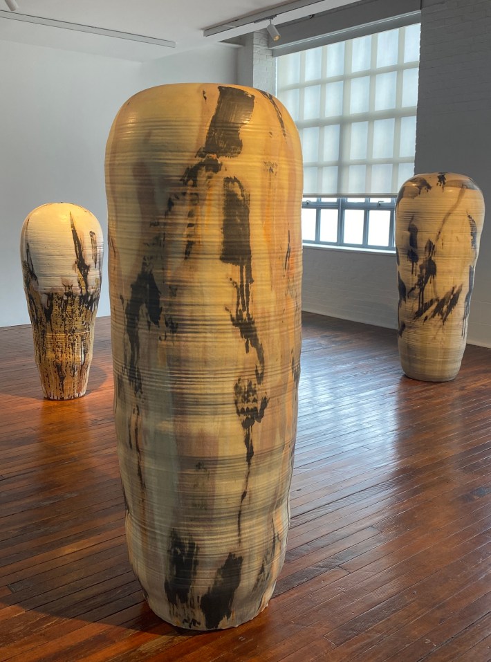 three tall, painted ceramic forms in Toshiko Takaezu's Star Series