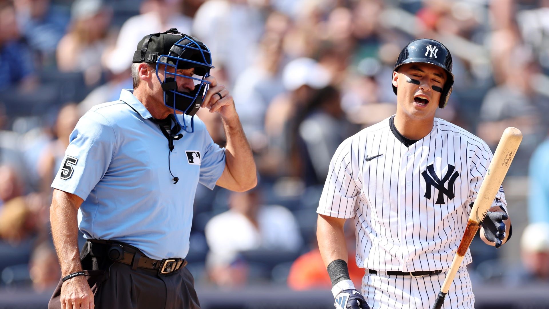 Anthony Volpe #11 of the New York Yankees reacts after a call made by home plate umpire umpire Angel Hernandez #5 during the fifth inning against the Houston Astros at Yankee Stadium.