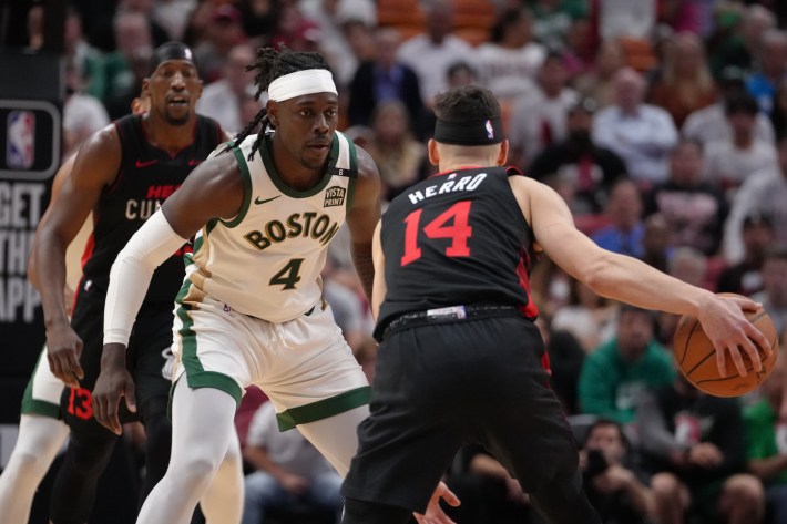 Jrue Holiday #4 of the Boston Celtics plays defense against Tyler Herro #14 of the Miami Heat on February 11, 2024.