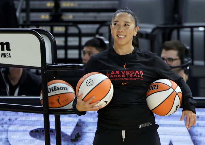 First assistant coach Natalie Nakase helps players warm up before a game against the Indiana Fever at Michelob ULTRA Arena on June 24, 2023 in Las Vegas, Nevada. The Aces defeated the Fever 101-88.