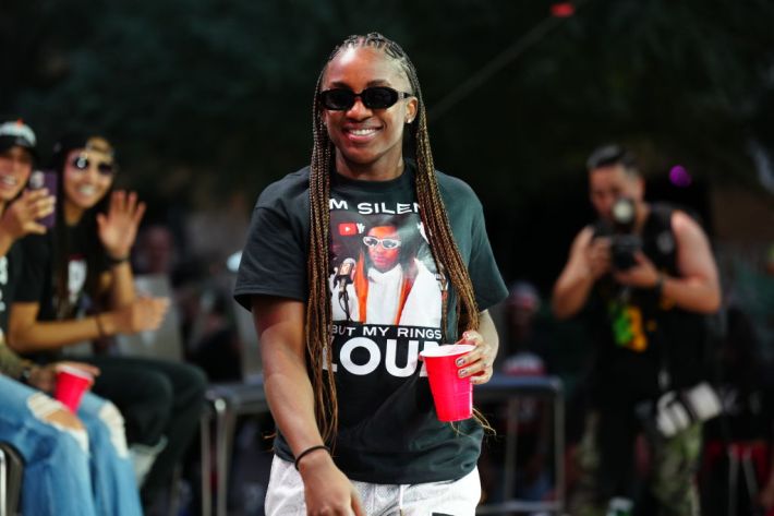 Jackie Young #0 of the Las Vegas Aces celebrates during the 2023 WNBA championship victory parade and rally on the Las Vegas Strip on October 23, 2023 in Las Vegas, Nevada.