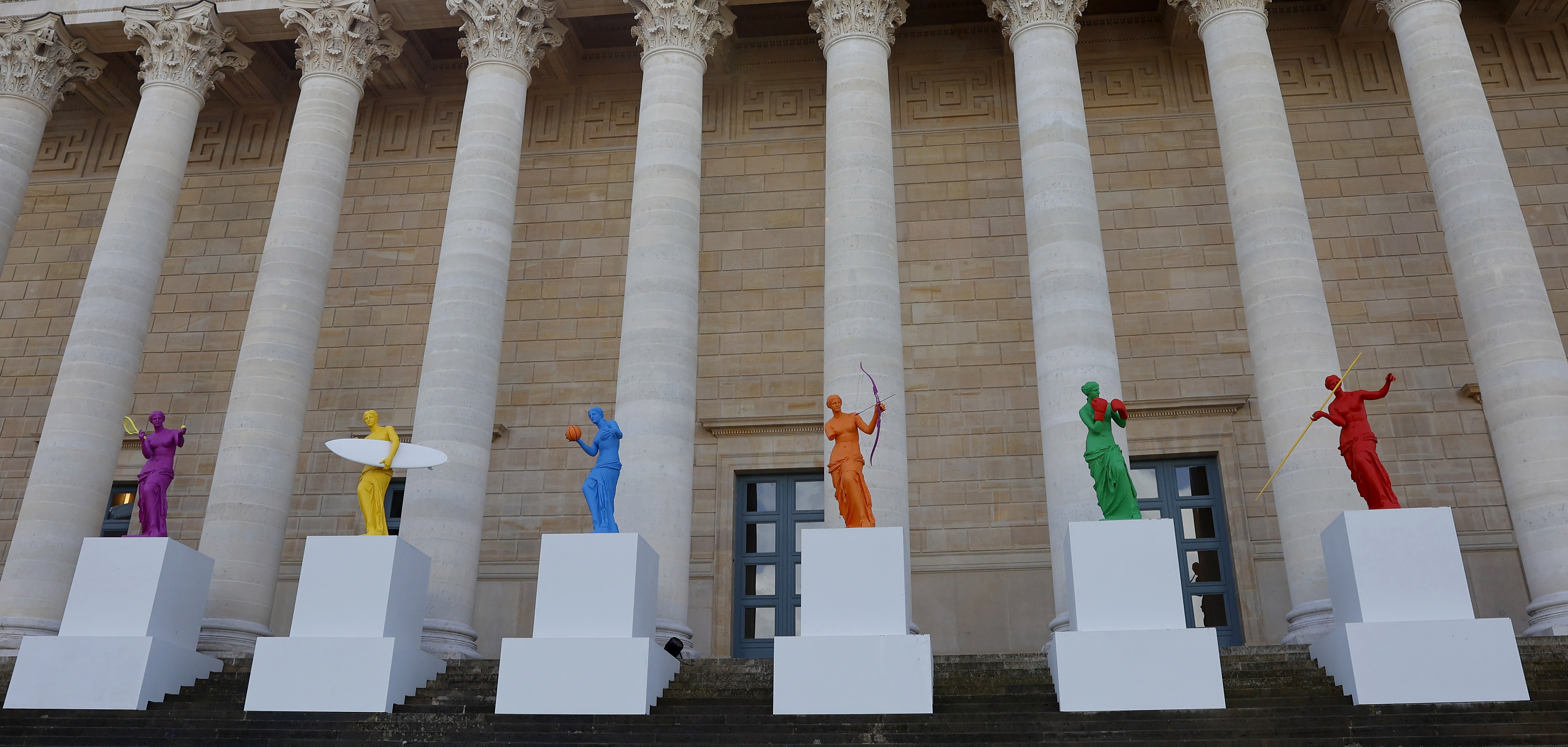 PARIS, FRANCE - APRIL 04: "La Beaute et le Geste" exhibition by French Artist Laurent Perbos is displayed in front of the French National assembly ahead of the Paris 2024 Olympic Games on April 04, 2024 in Paris, France. On the occasion of the Paris 2024 Olympic and Paralympic Games, the National Assembly celebrates sport by welcoming the visual artist Laurent Perbos and his 6 metamorphosed Venus de Milo. A universally known work, the Venus here finds her arms and is endowed attributes of six sporting disciplines: tennis, surfing, para archery, basketball, boxing and javelin throwing. (Photo by Chesnot/Getty Images)