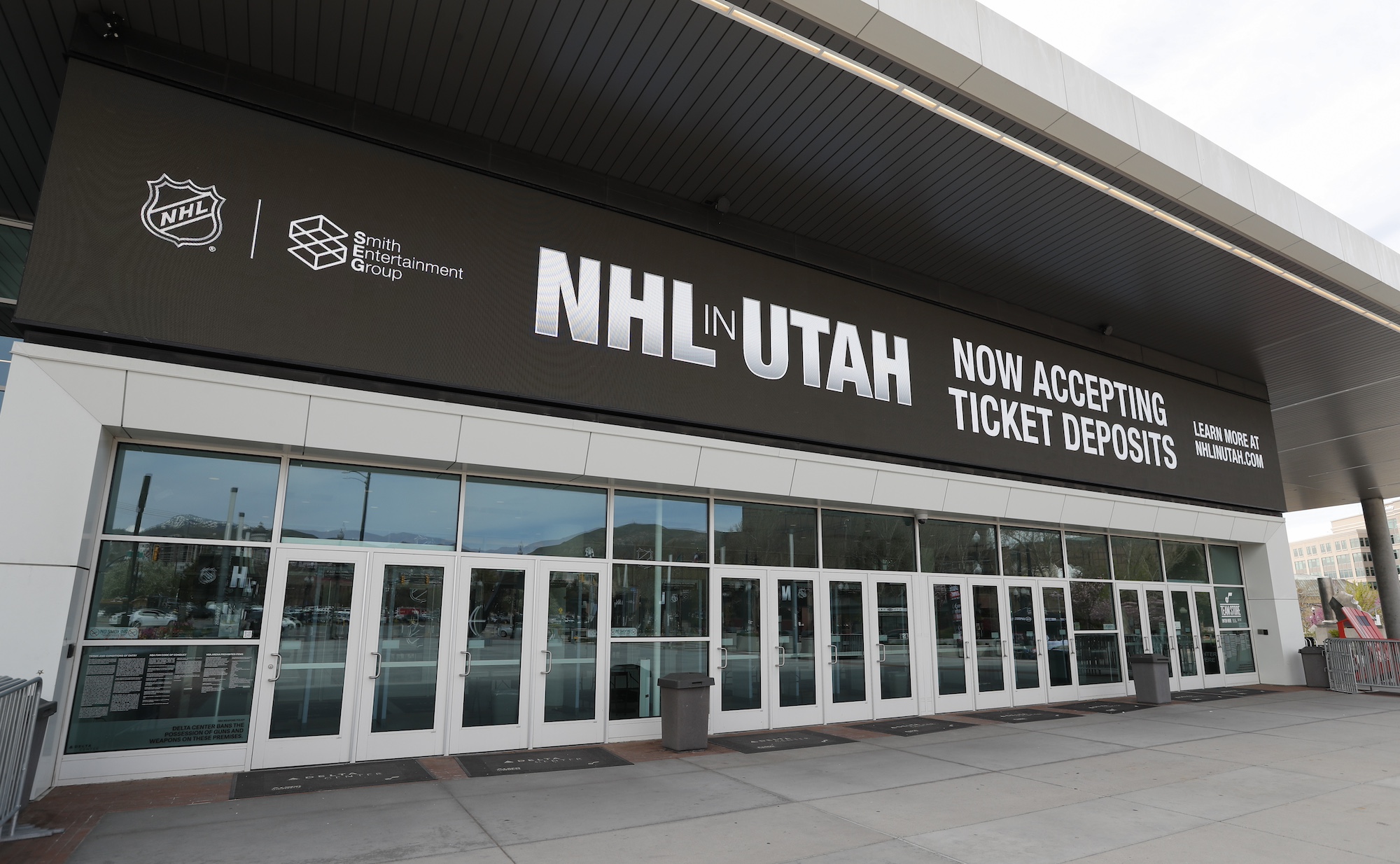 SALT LAKE CITY, UT - APRIL 19: The main entrance of the Delta Center is seen with the "NHL in Utah" logos on April 19, 2024 in Salt Lake City, Utah. The NHL has allowed the sale of the Arizona Coyotes and the team will relocate to Salt Lake City, Utah. (Photo by Chris Gardner/Getty Images)