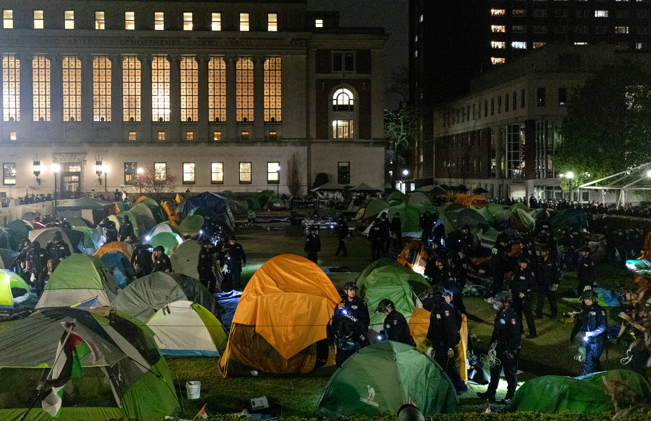 NYPD officers in riot gear enter Columbia University's encampment
