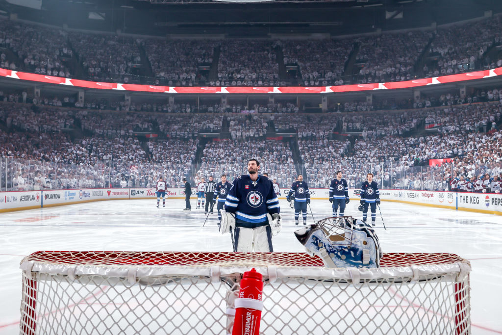 Connor Hellebuyck during the singing of O Canada