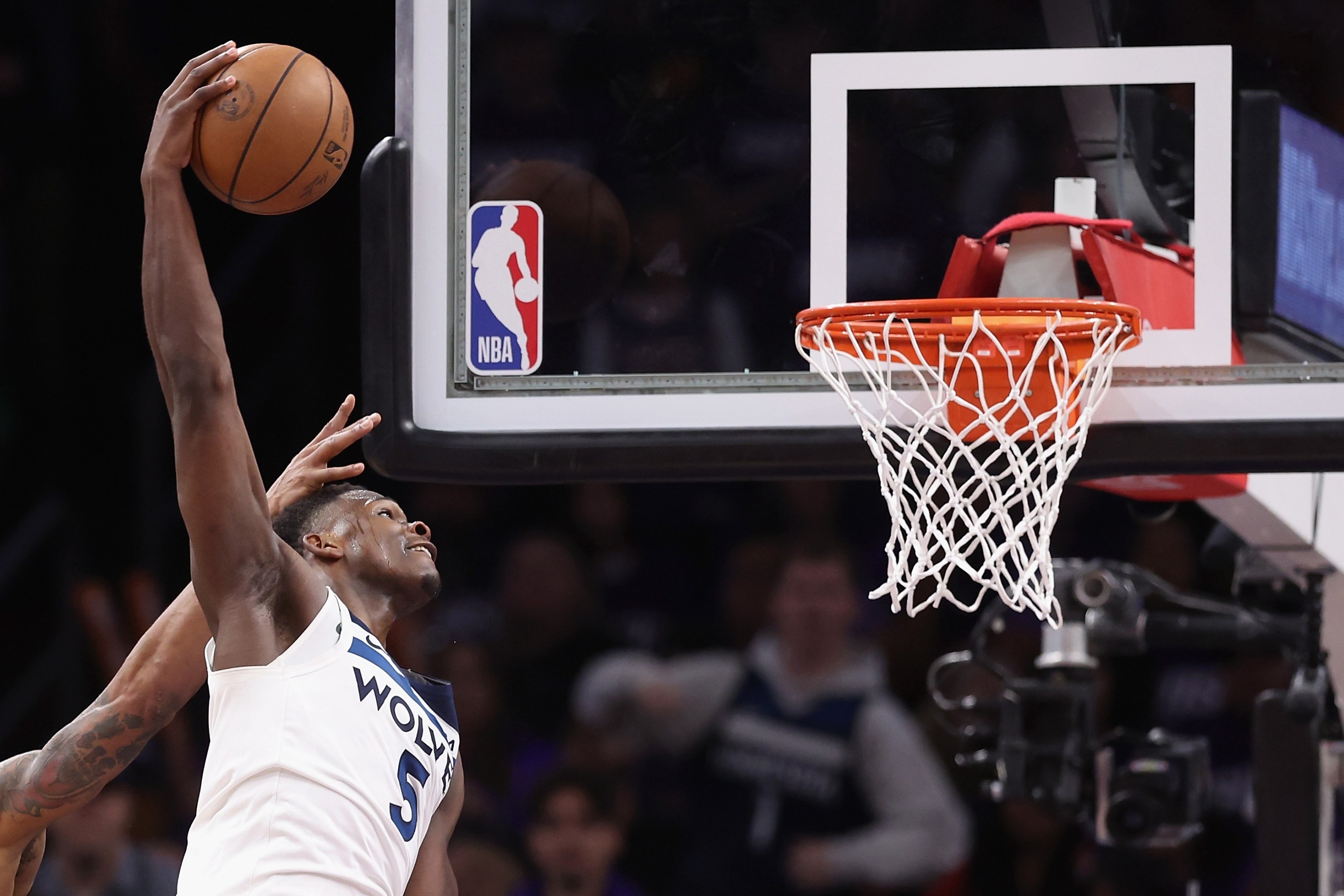 PHOENIX, ARIZONA - APRIL 28: Anthony Edwards #5 of the Minnesota Timberwolves slam dunks the ball ahead of Bradley Beal #3 of the Phoenix Suns during the second half of game four of the Western Conference First Round Playoffs at Footprint Center on April 28, 2024 in Phoenix, Arizona. The Timberwolves defeated the Suns 122-116 and win the series 4-0. NOTE TO USER: User expressly acknowledges and agrees that, by downloading and or using this photograph, User is consenting to the terms and conditions of the Getty Images License Agreement. (Photo by Christian Petersen/Getty Images)