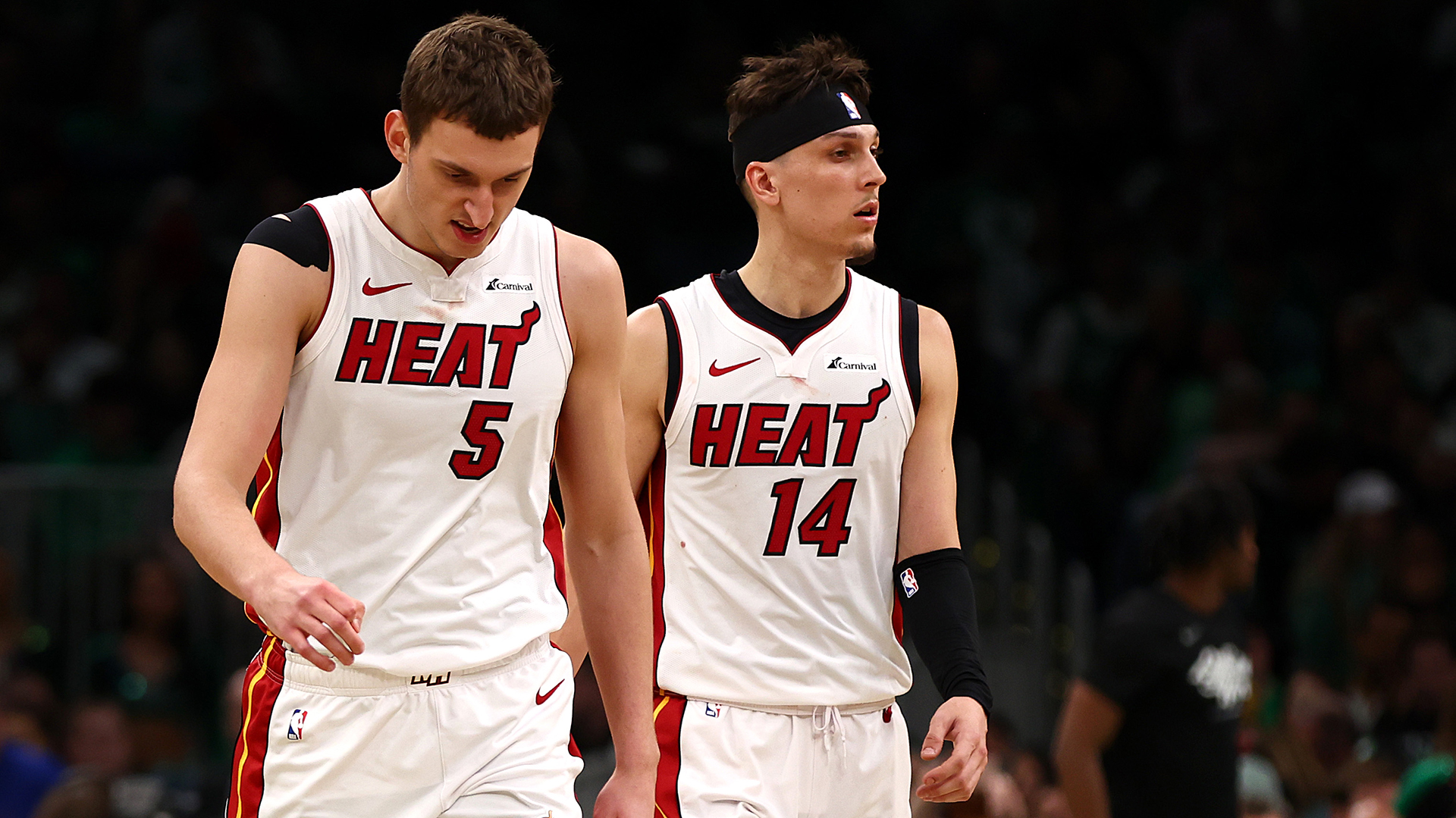 Nikola Jovic #5 and Tyler Herro #14 of the Miami Heat walk to the bench during the third quarter of game five of the Eastern Conference First Round Playoffs at TD Garden on May 01, 2024 in Boston, Massachusetts.