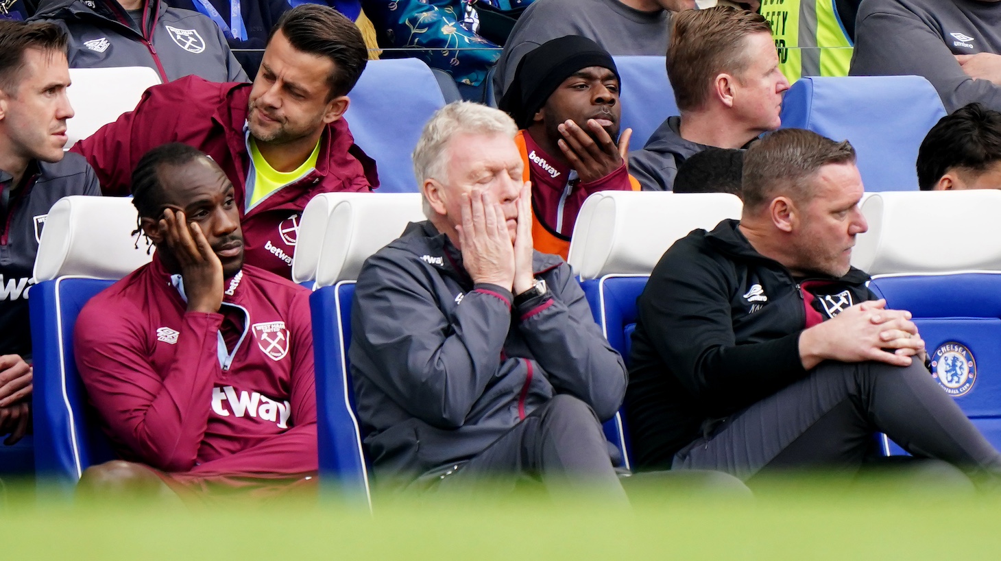 West Ham United manager David Moyes (centre), first team coach Kevin Nolan (right) and player Michail Antonio (left) during the Premier League match at Stamford Bridge, London. Picture date: Sunday May 5, 2024.