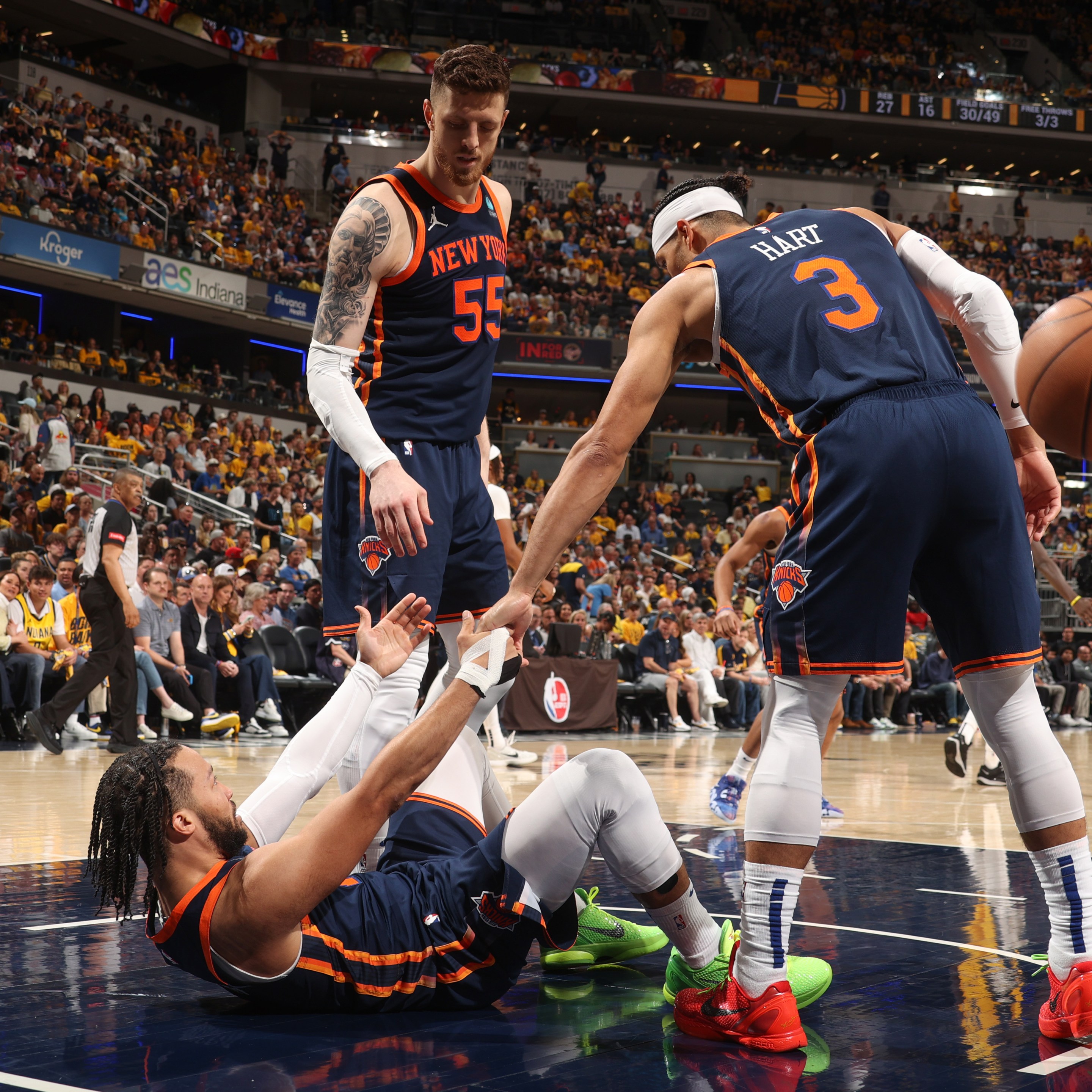 Isaiah Hartenstein #55 of the New York Knicks &amp; Josh Hart #3 of the New York Knicks help Jalen Brunson #11 of the New York Knicks up during the game against the Indiana Pacers during Round 2 Game 4 of the 2024 NBA Playoffs on May 12, 2024 at Gainbridge Fieldhouse in Indianapolis, Indiana. NOTE TO USER: User expressly acknowledges and agrees that, by downloading and or using this Photograph, user is consenting to the terms and conditions of the Getty Images License Agreement. Mandatory Copyright Notice: Copyright 2024 NBAE (Photo by Nathaniel S. Butler/NBAE via Getty Images)