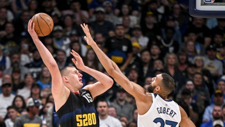 Nikola Jokic (15) of the Denver Nuggets shoots over Rudy Gobert (27) of the Minnesota Timberwolves during the second quarter at Ball Arena in Denver on Tuesday, May 14, 2024.
