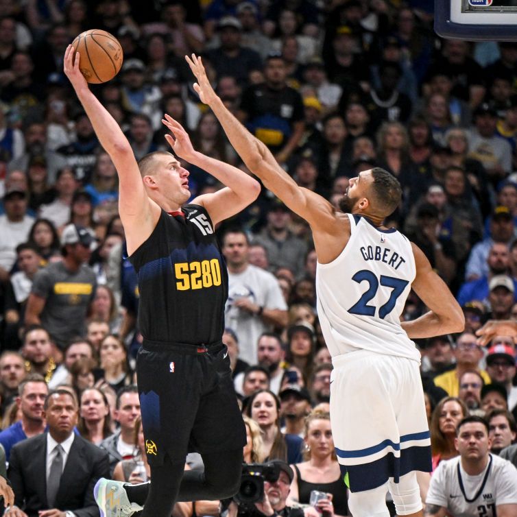 Nikola Jokic (15) of the Denver Nuggets shoots over Rudy Gobert (27) of the Minnesota Timberwolves during the second quarter at Ball Arena in Denver on Tuesday, May 14, 2024.