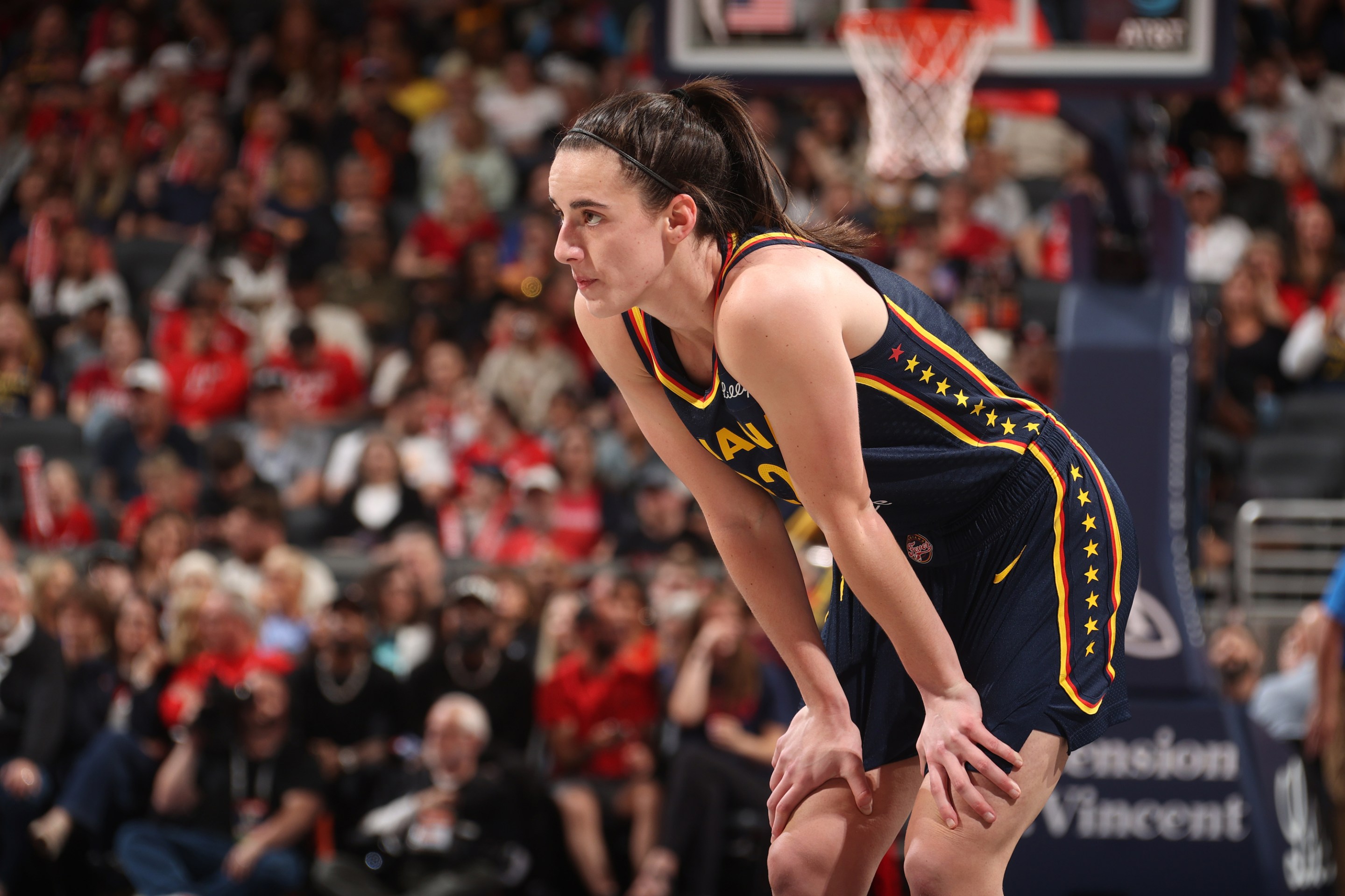 Caitlin Clark #22 of the Indiana Fever looks on during the game against the New York Liberty on May 16, 2024 at Gainbridge Fieldhouse in Indianapolis, Indiana.