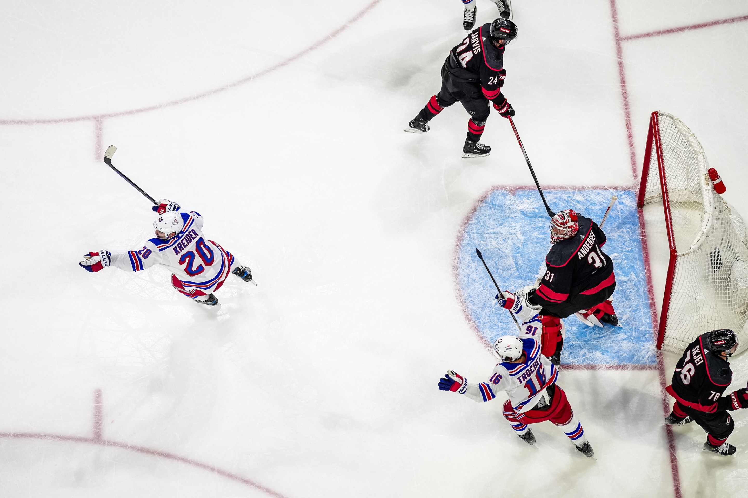 RALEIGH, NORTH CAROLINA - MAY 16: Chris Kreider #20 of the New York Rangers celebrates after scoring a goal against Frederik Andersen #31 of the Carolina Hurricanes during the third period in Game Six of the Second Round of the 2024 Stanley Cup Playoffs at PNC Arena on May 16, 2024 in Raleigh, North Carolina. (Photo by Josh Lavallee/NHLI via Getty Images)