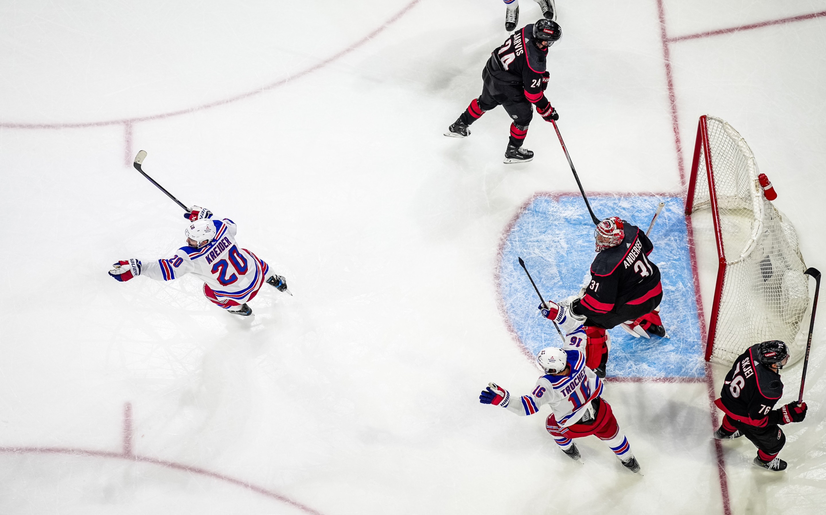 RALEIGH, NORTH CAROLINA - MAY 16: Chris Kreider #20 of the New York Rangers celebrates after scoring a goal against Frederik Andersen #31 of the Carolina Hurricanes during the third period in Game Six of the Second Round of the 2024 Stanley Cup Playoffs at PNC Arena on May 16, 2024 in Raleigh, North Carolina. (Photo by Josh Lavallee/NHLI via Getty Images)