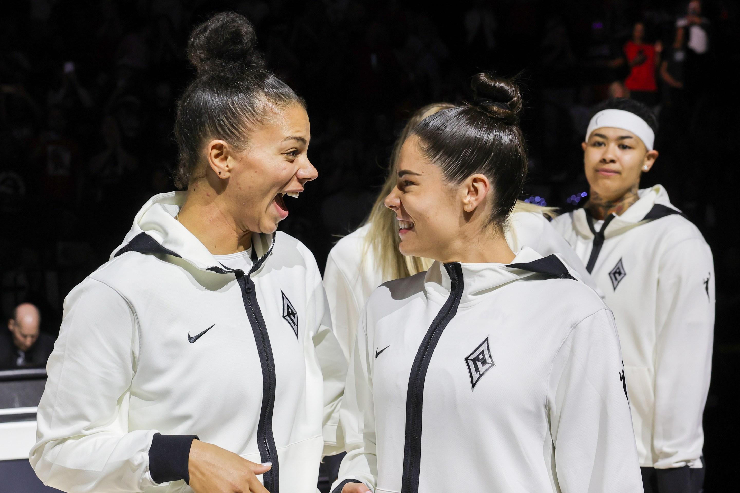 Alysha Clark (L) #7 and Kelsey Plum #10 of the Las Vegas Aces react after receiving their 2023 WNBA championship rings before the team's home opener against the Phoenix Mercury on May 14, 2024 in Las Vegas, Nevada. The Aces defeated the Mercury 89-80.