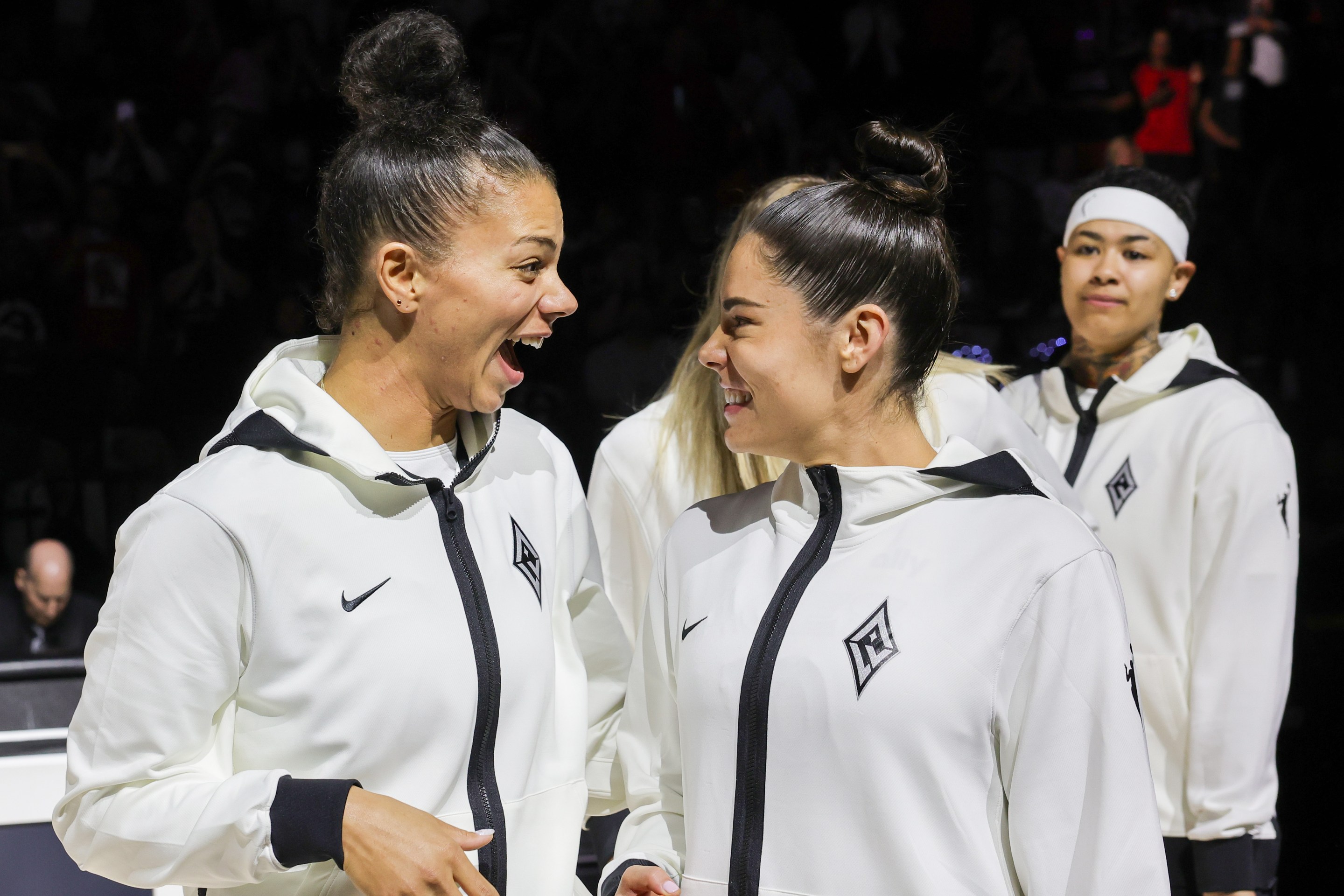 Alysha Clark (L) #7 and Kelsey Plum #10 of the Las Vegas Aces react after receiving their 2023 WNBA championship rings before the team's home opener against the Phoenix Mercury on May 14, 2024 in Las Vegas, Nevada. The Aces defeated the Mercury 89-80.