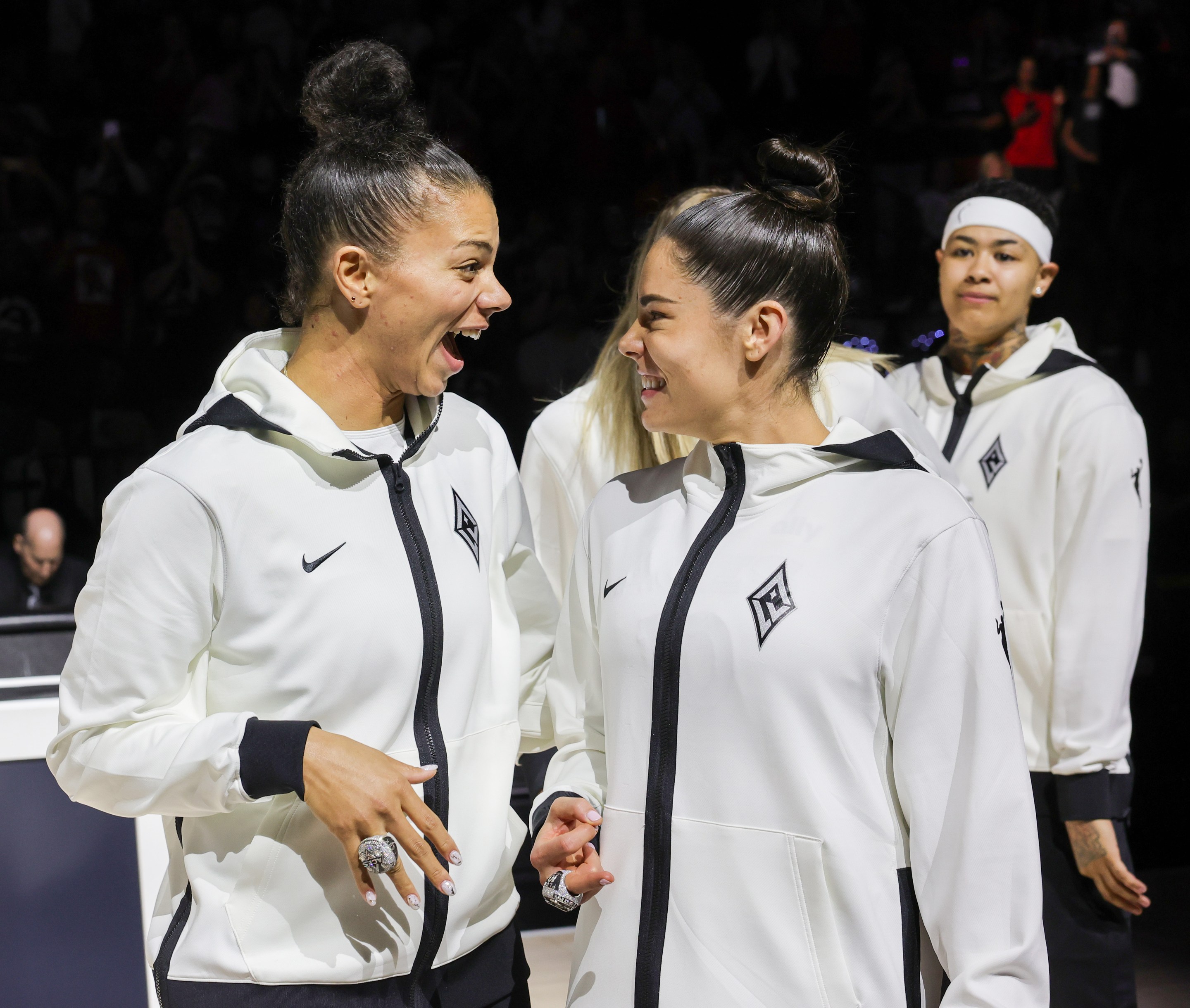 Alysha Clark (L) #7 and Kelsey Plum #10 of the Las Vegas Aces react after receiving their 2023 WNBA championship rings before the team's home opener against the Phoenix Mercury on May 14, 2024 in Las Vegas, Nevada. The Aces defeated the Mercury 89-80.