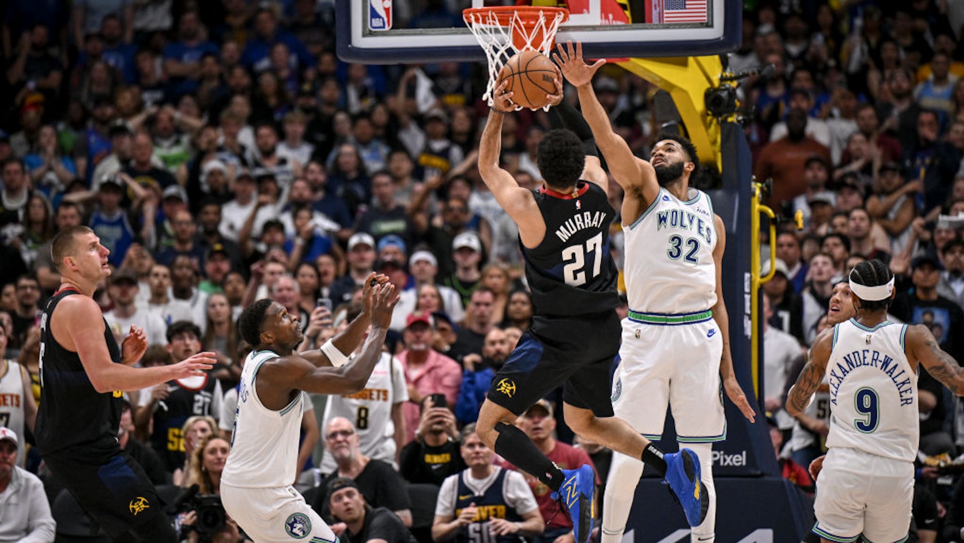 Jamal Murray (27) of the Denver Nuggets shoots over Karl-Anthony Towns (32) of the Minnesota Timberwolves during the second quarter at Ball Arena in Denver on Sunday, May 19, 2024.