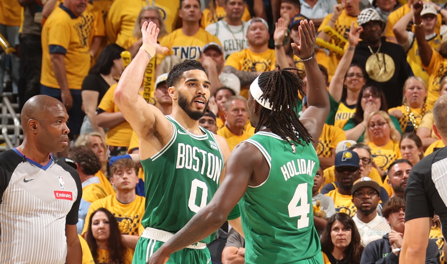 INDIANAPOLIS, IN - MAY 25: Jayson Tatum #0 and Jrue Holiday #4 of the Boston Celtics high five during the game against the Indiana Pacers during Game 3 of the Eastern Conference Finals of the 2024 NBA Playoffs on May 25, 2024 at Gainbridge Fieldhouse in Indianapolis, Indiana. NOTE TO USER: User expressly acknowledges and agrees that, by downloading and or using this Photograph, user is consenting to the terms and conditions of the Getty Images License Agreement. Mandatory Copyright Notice: Copyright 2024 NBAE (Photo by Nathaniel S. Butler/NBAE via Getty Images)