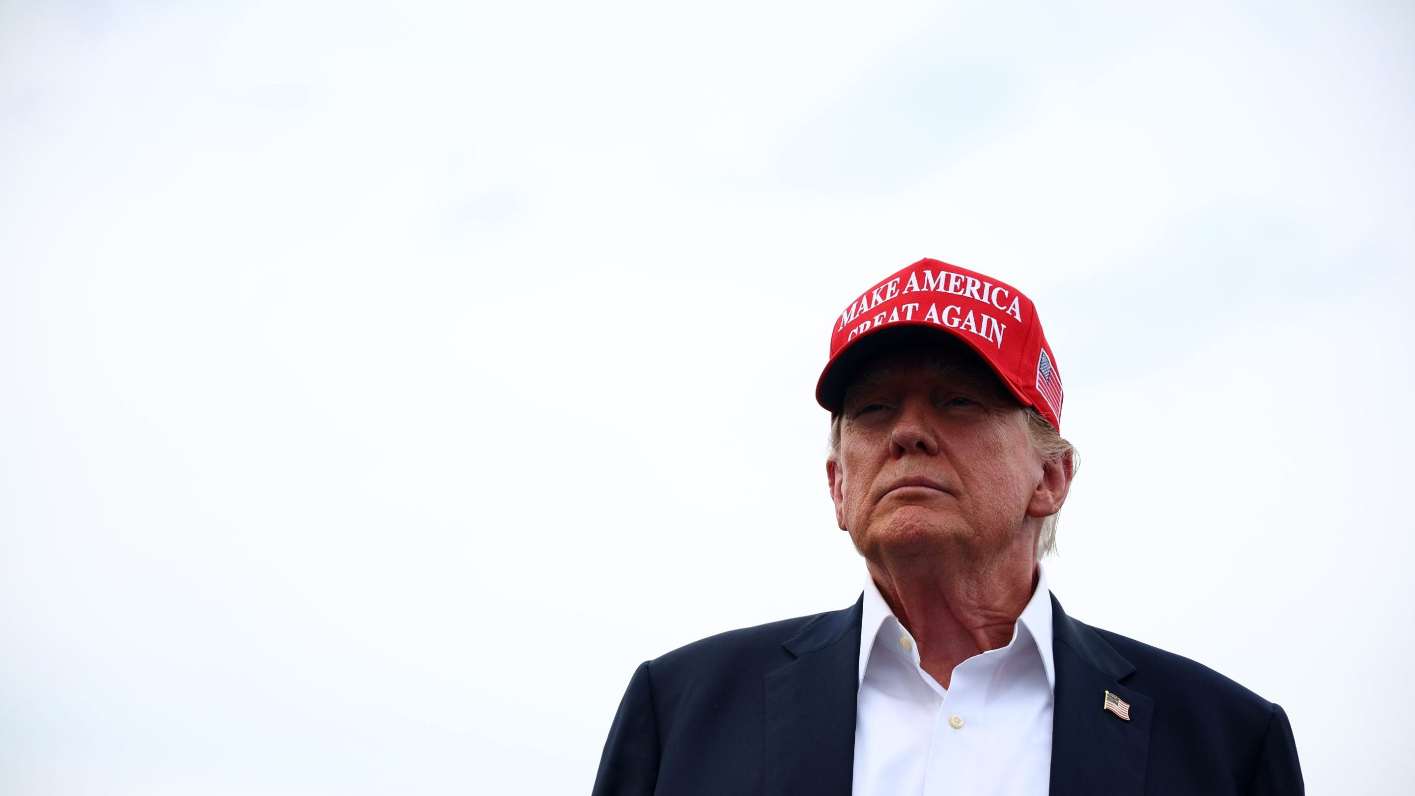Former U.S. President and Republican presidential candidate Donald Trump attends the NASCAR Cup Series Coca-Cola 600 at Charlotte Motor Speedway on May 26, 2024 in Concord, North Carolina. He is wearing a make American Great Again hat.