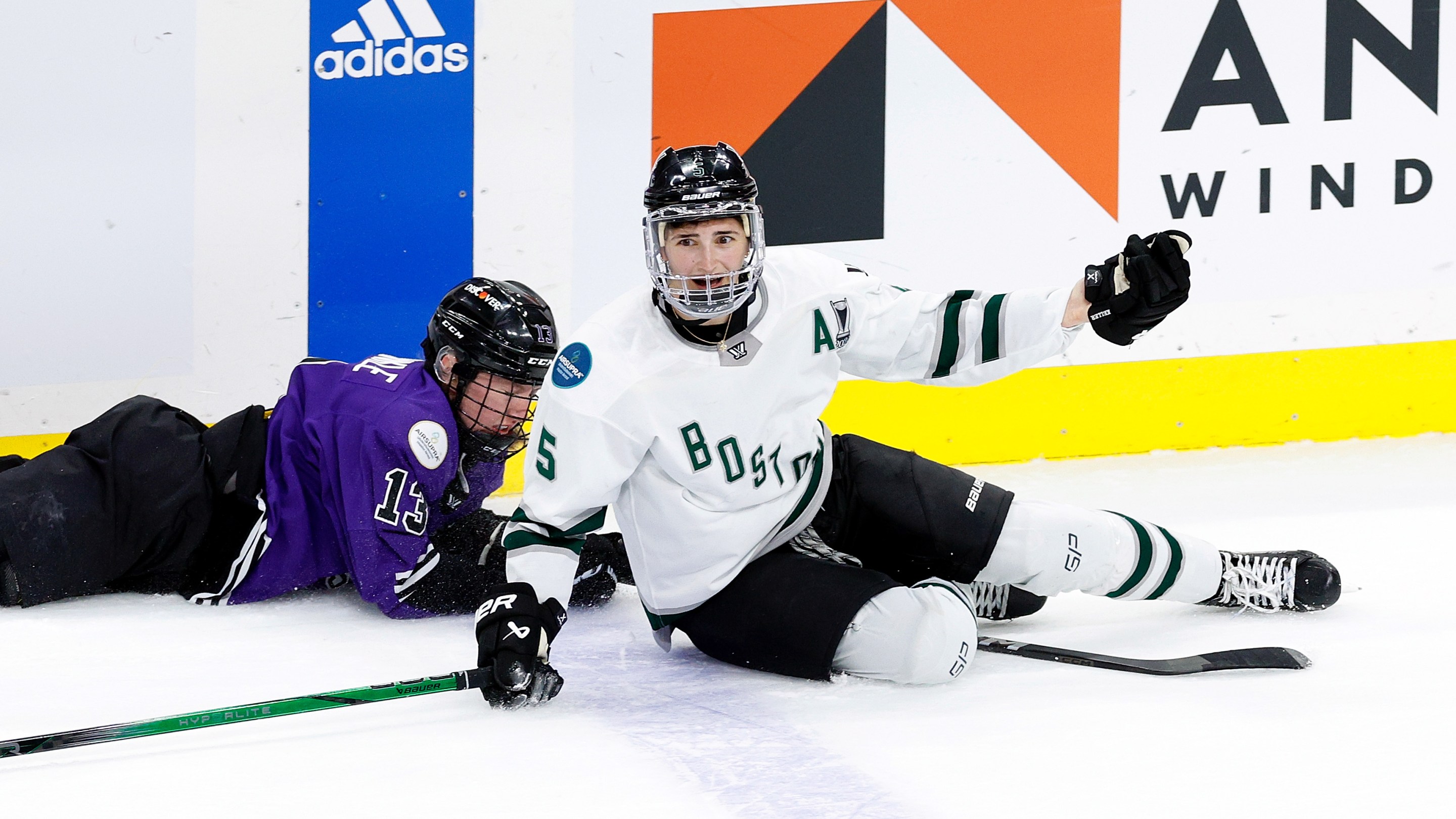 Megan Keller #5 of Boston reacts to a collision with Grace Zumwinkle #13 of Minnesota