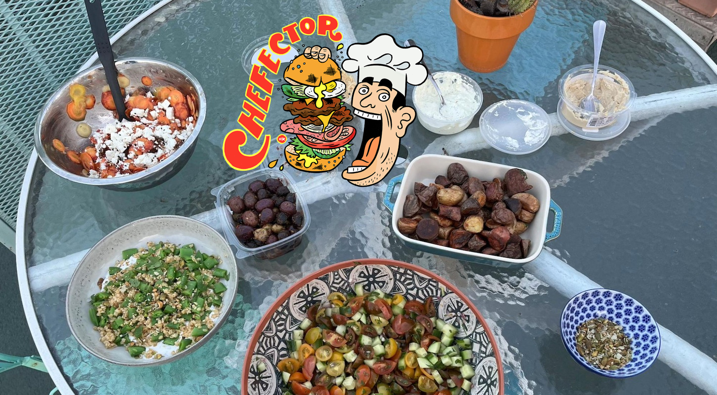 A tabletop laden with various delicious salads and some roasted potatoes and spreads, with a cartoon logo.