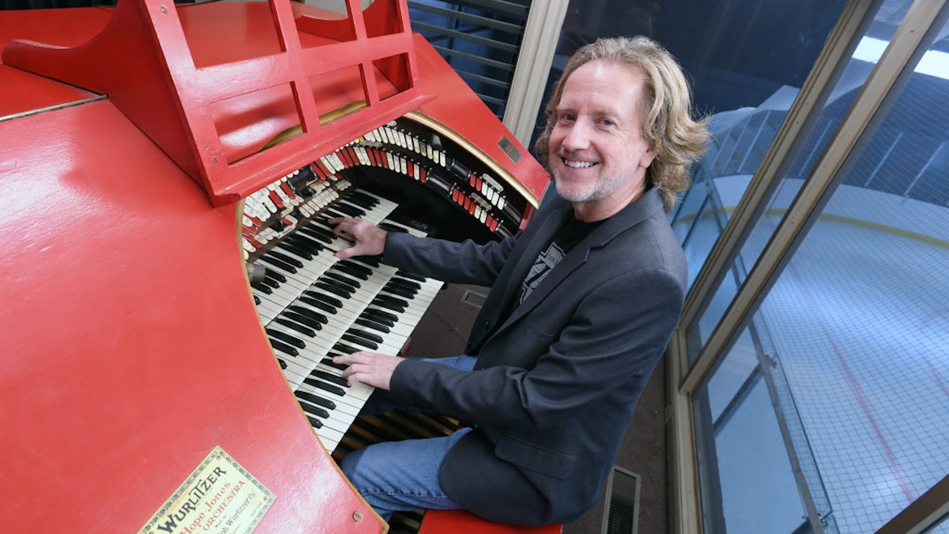 Los Angeles Kings music director, Dieter Ruehle, plays a 1941 Wurlitzer organ during the ribbon cutting and reopening of the LA Kings Iceland at Paramount on October 26, 2022 in Paramount California.