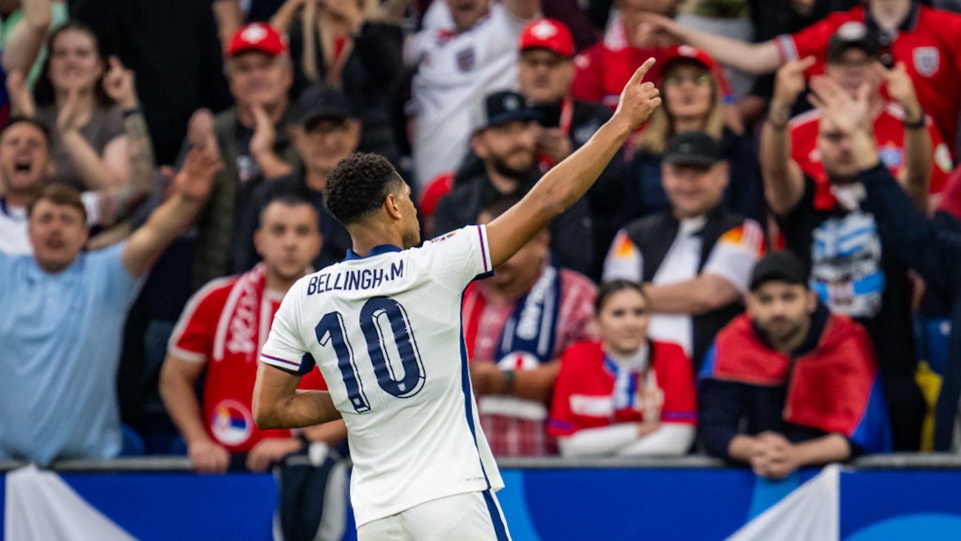 Jude Bellingham of England celebrates after scoring his team's first goal during the UEFA EURO 2024 group stage match between Serbia and England at Arena AufSchalke on June 16, 2024 in Gelsenkirchen, Germany.