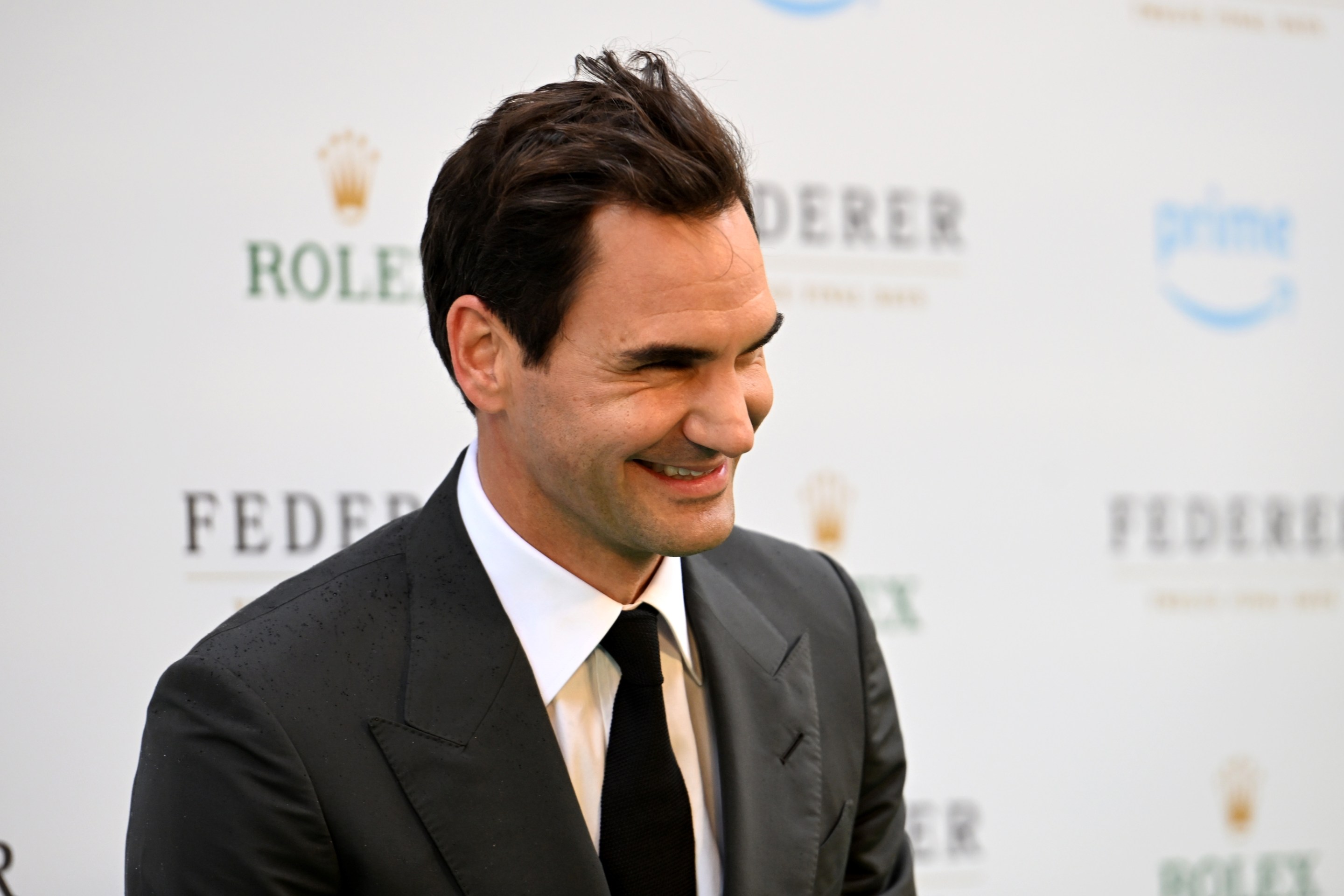 Roger Federer poses for photos