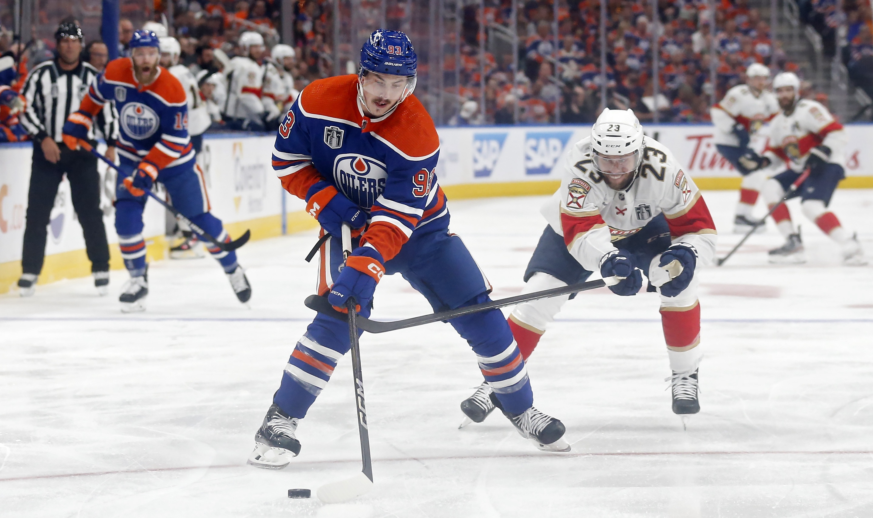 EDMONTON, CANADA - JUNE 13: Ryan Nugent-Hopkins #93 of the Edmonton Oilers skates past Carter Verhaeghe #23 of the Florida Panthers during the first period of Game Three of the 2024 Stanley Cup Final at Rogers Place on June 13, 2024 in Edmonton, Alberta, Canada. (Photo by Codie McLachlan/Getty Images)