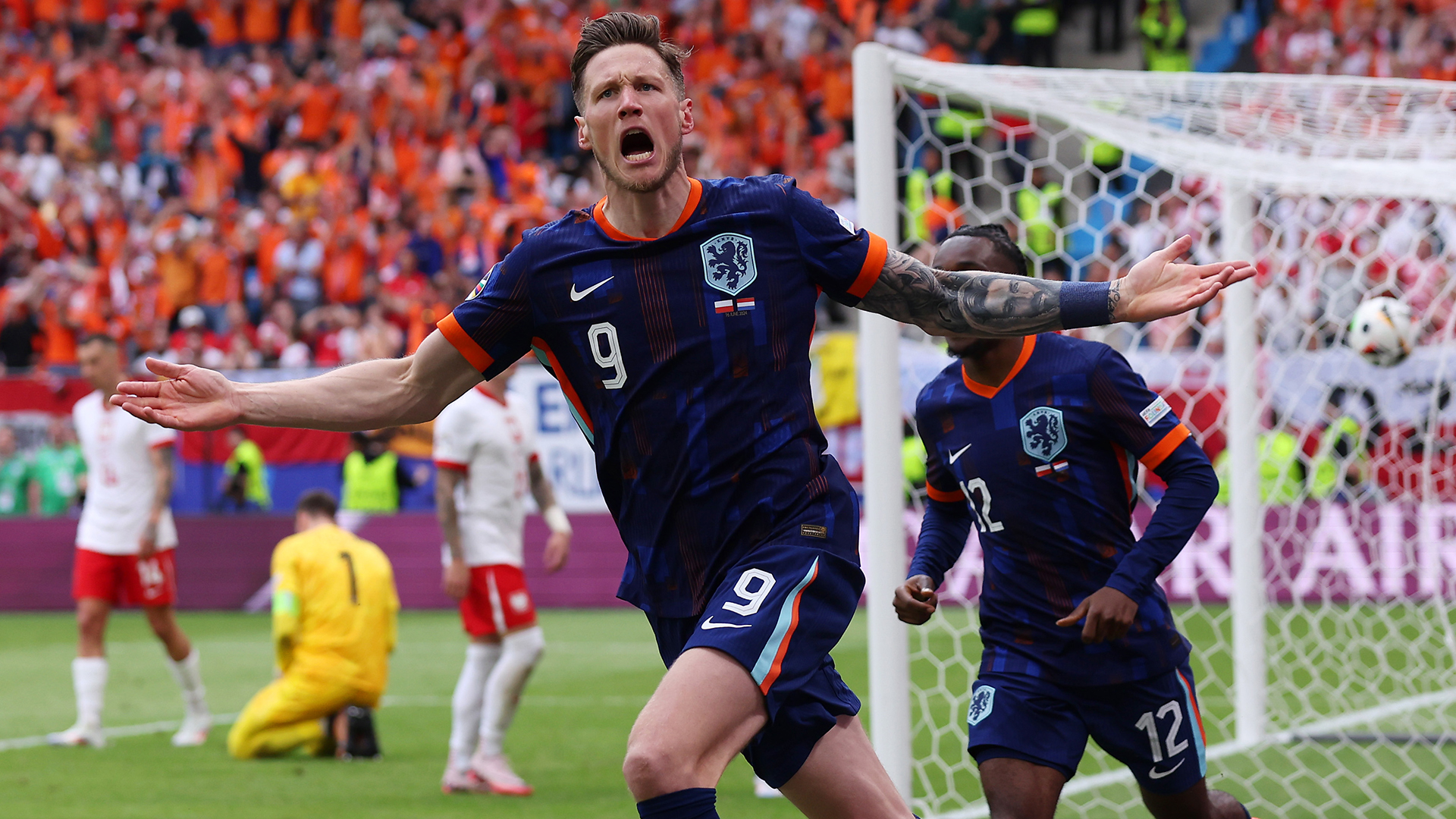 Wout Weghorst of the Netherlands celebrates scoring his team's second goal with teammates during the UEFA EURO 2024 group stage match between Poland and Netherlands at Volksparkstadion on June 16, 2024 in Hamburg, Germany.
