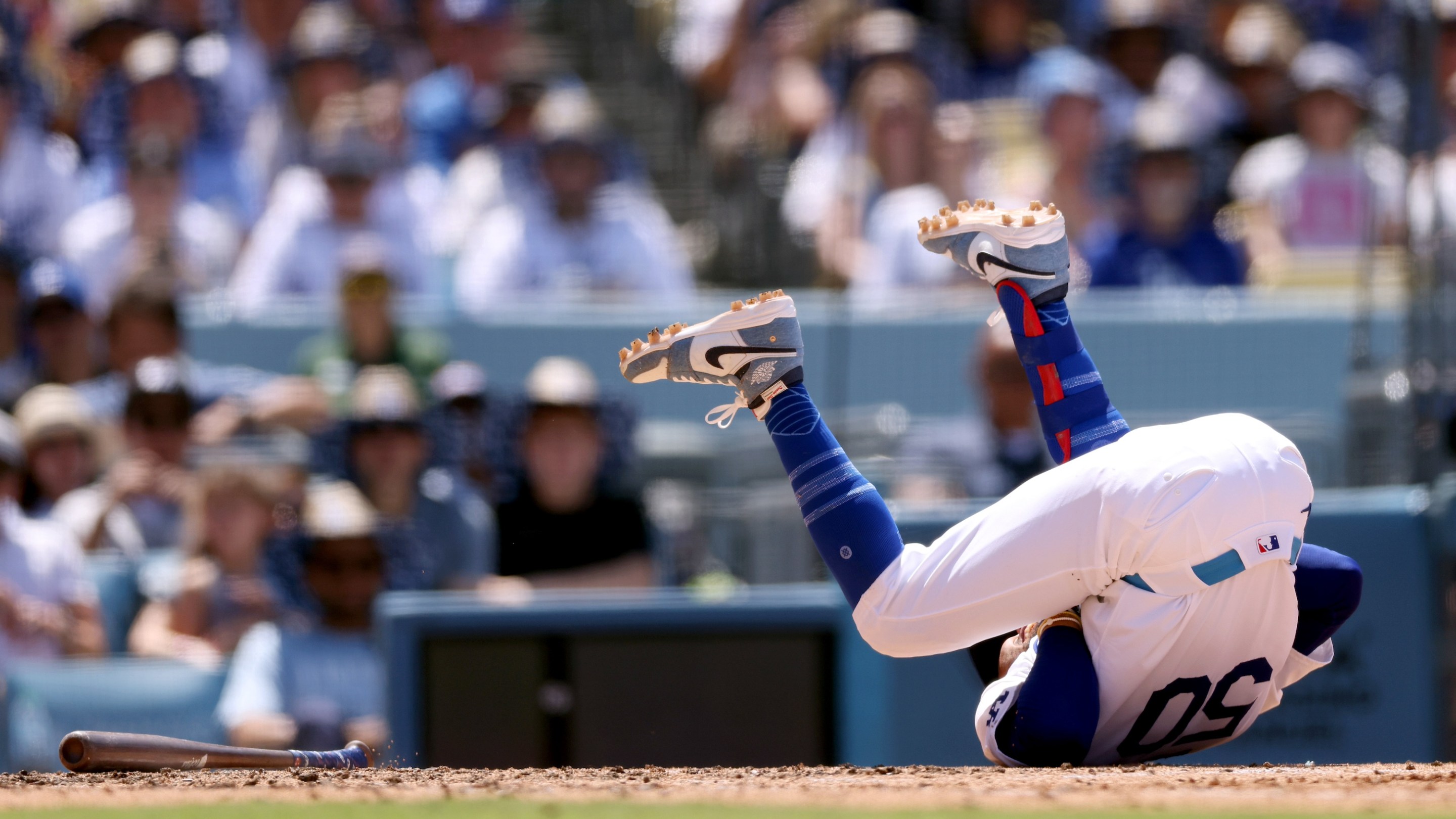 LOS ANGELES, CALIFORNIA - JUNE 16: Mookie Betts #50 of the Los Angeles Dodgers reacts after getting hit by a pitch during the seventh inning against the Kansas City Royals at Dodger Stadium on June 16, 2024 in Los Angeles, California. (Photo by Katelyn Mulcahy/Getty Images)