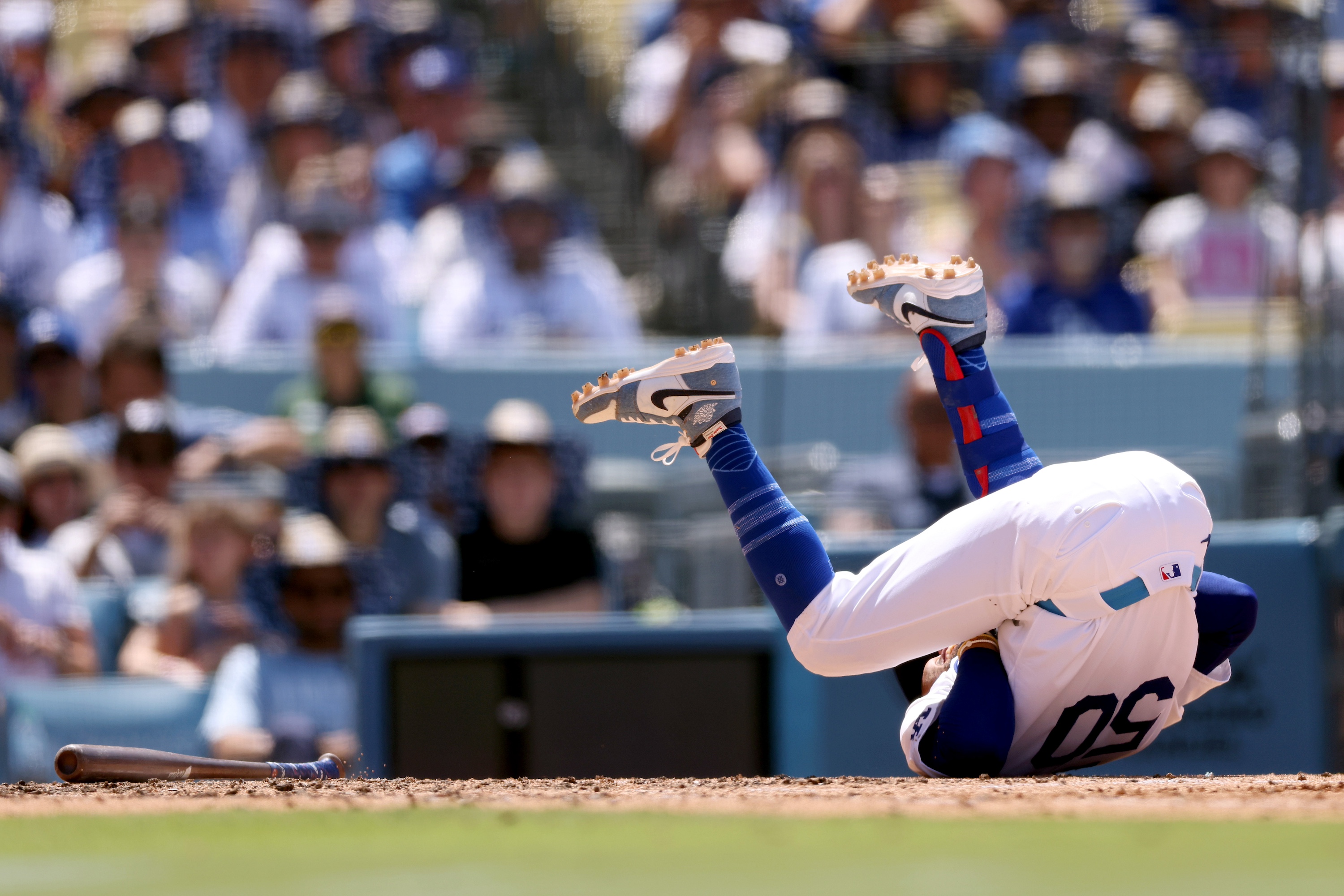 LOS ANGELES, CALIFORNIA - JUNE 16: Mookie Betts #50 of the Los Angeles Dodgers reacts after getting hit by a pitch during the seventh inning against the Kansas City Royals at Dodger Stadium on June 16, 2024 in Los Angeles, California. (Photo by Katelyn Mulcahy/Getty Images)