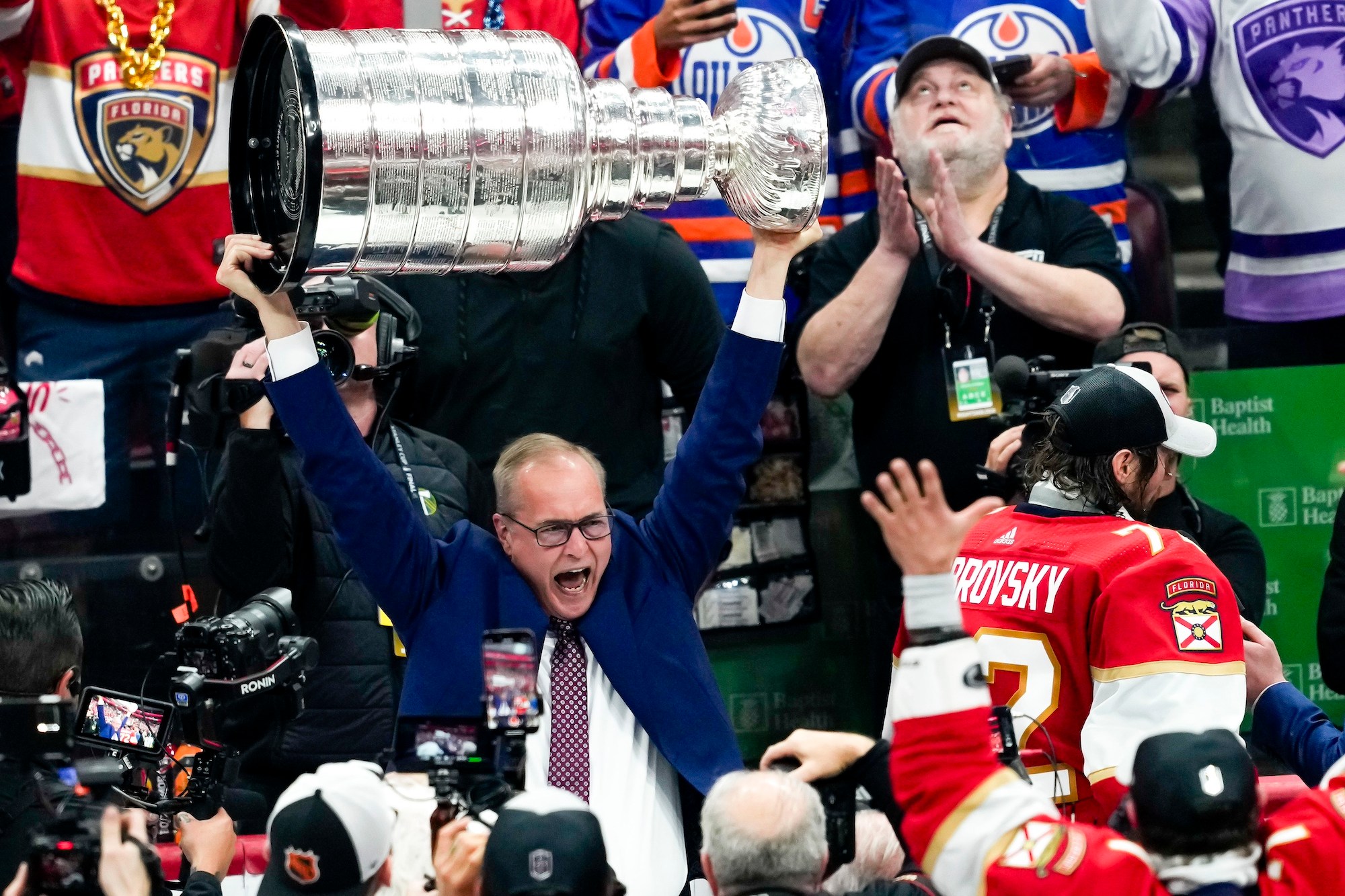 SUNRISE, FL - JUNE 24: Florida Panthers head coach Paul Maurice raises the Stanley Cup during the NHL Stanley Cup Finals, Game 7 between the Florida Panthers and Edmonton Oilers on June 24th, 2024 at Amerant Bank Arena in Sunrise, FL. (Photo by Andrew Bershaw/Icon Sportswire via Getty Images)