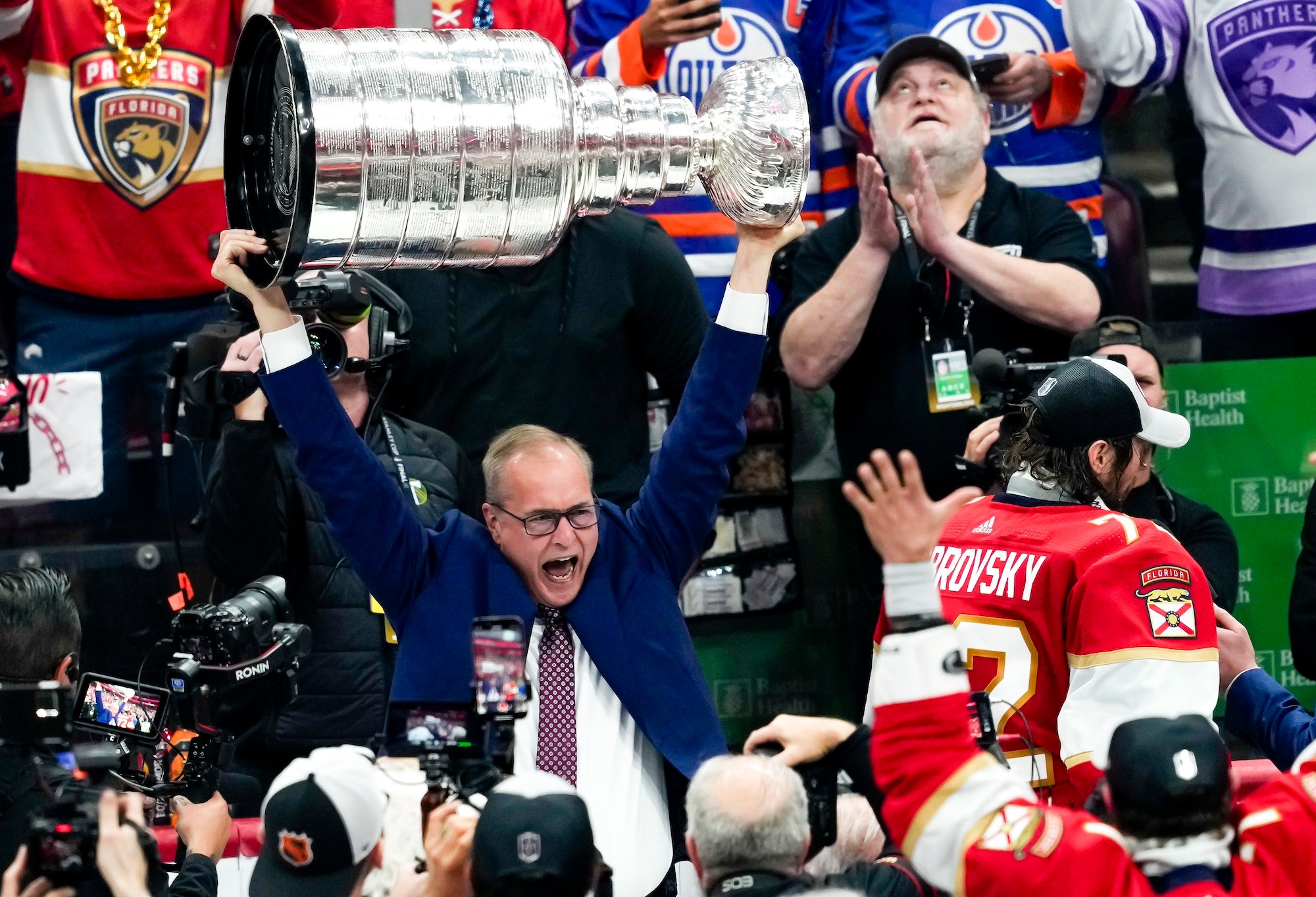 SUNRISE, FL - JUNE 24: Florida Panthers head coach Paul Maurice raises the Stanley Cup during the NHL Stanley Cup Finals, Game 7 between the Florida Panthers and Edmonton Oilers on June 24th, 2024 at Amerant Bank Arena in Sunrise, FL. (Photo by Andrew Bershaw/Icon Sportswire via Getty Images)