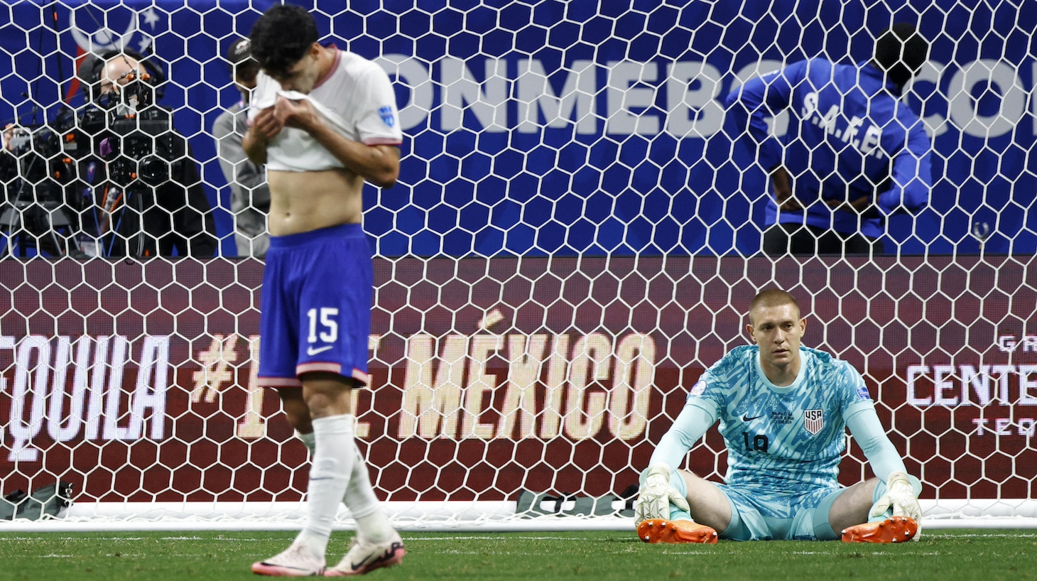 USA's midfielder #15 Joao Lucas Cardoso and USA's goalkeeper #18 Ethan Horvath gesture after Panama's forward #17 Jose Fajardo scores his team's second goal during the Conmebol 2024 Copa America tournament group C football match between Panama and USA at Mercedes Benz Stadium in Atlanta, Georgia, on June 27, 2024.