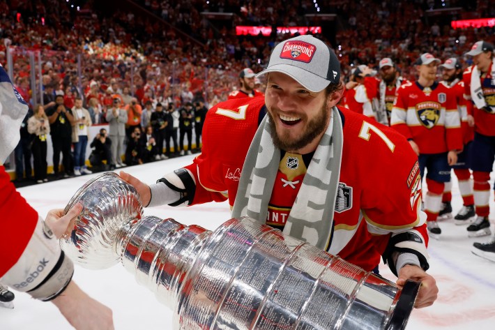 SUNRISE, FLORIDA - JUNE 24: Dmitry Kulikov #7 of the Florida Panthers laughs while lifting the Stanley Cup after Florida's 2-1 victory against the Edmonton Oilers in Game Seven of the 2024 Stanley Cup Final at Amerant Bank Arena on June 24, 2024 in Sunrise, Florida.