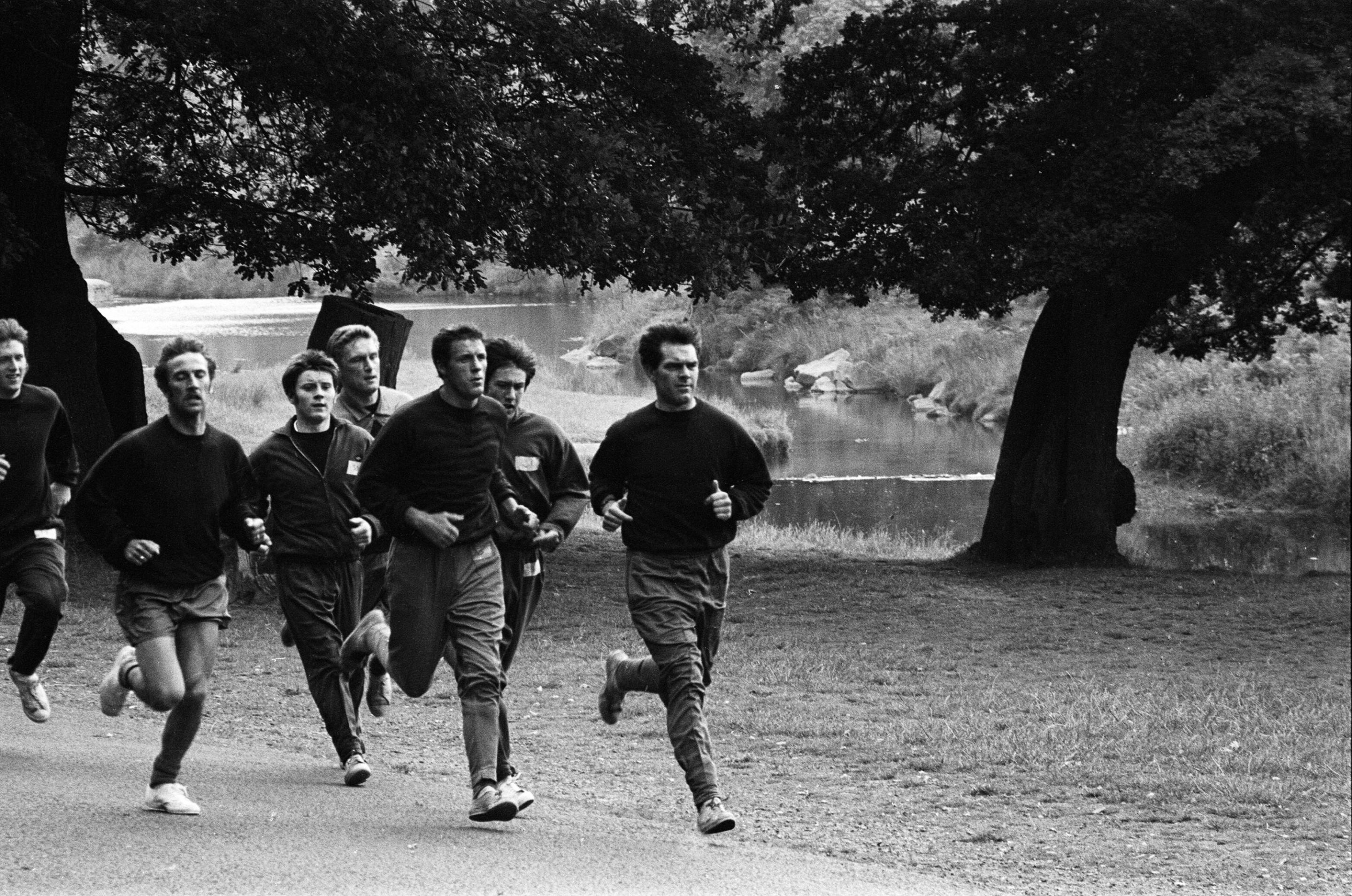 Men running in the countryside