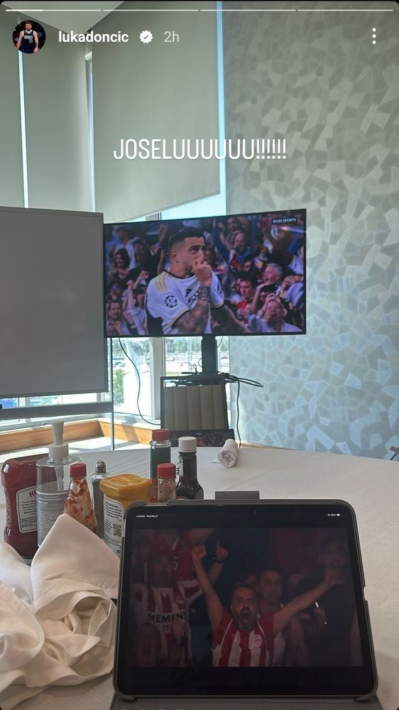Luka's set-up for a soccer game: another TV on a rolling stands, a second screen with nothing on it, a collection of condiments, and also an ipad possibly playing a different game. More rolled silverware, too.
