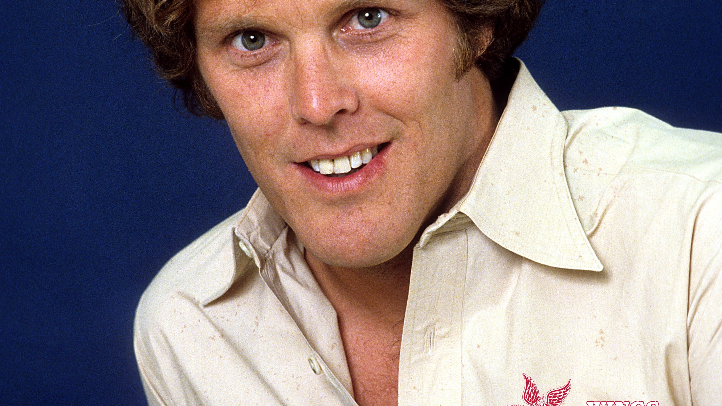 Actor Wings Hauser poses for a portrait in circa 1980. The Defector Wings Week logo is on his shirt.