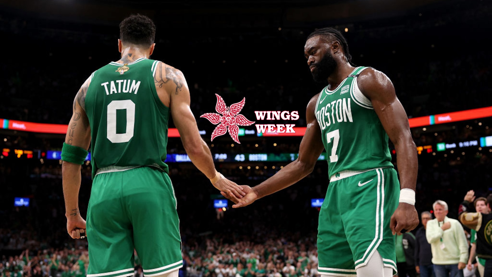 Jayson Tatum #0 high fives Jaylen Brown #7 of the Boston Celtics after a play against the Dallas Mavericks during the second quarter of Game Five of the 2024 NBA Finals at TD Garden on June 17, 2024 in Boston, Massachusetts.