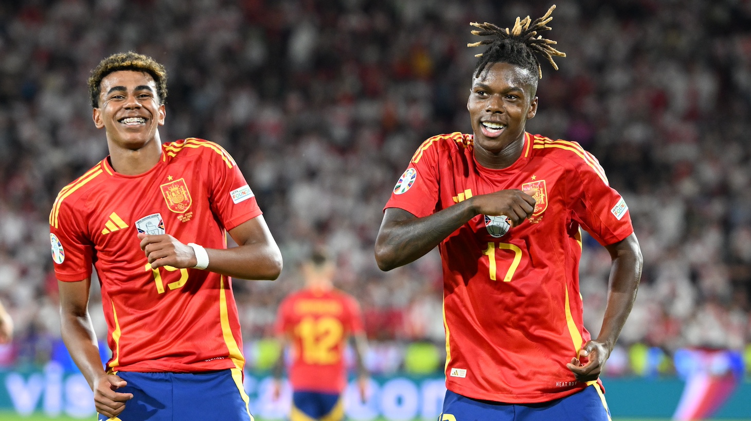 Lamine Yamal (17) and Nico Williams (19) of Spain celebrate during the UEFA EURO 2024 round of 16 match between Spain and Georgia at Cologne Stadium on June 30, 2024 in Cologne, Germany.