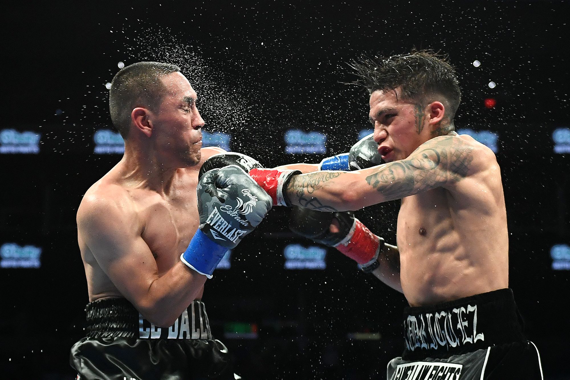 esse ‘Bam’ Rodriguez (R) of the United States and Juan Francisco Estrada (L) of Mexico fight during their WBC world and Ring Magazine super flyweight title bout